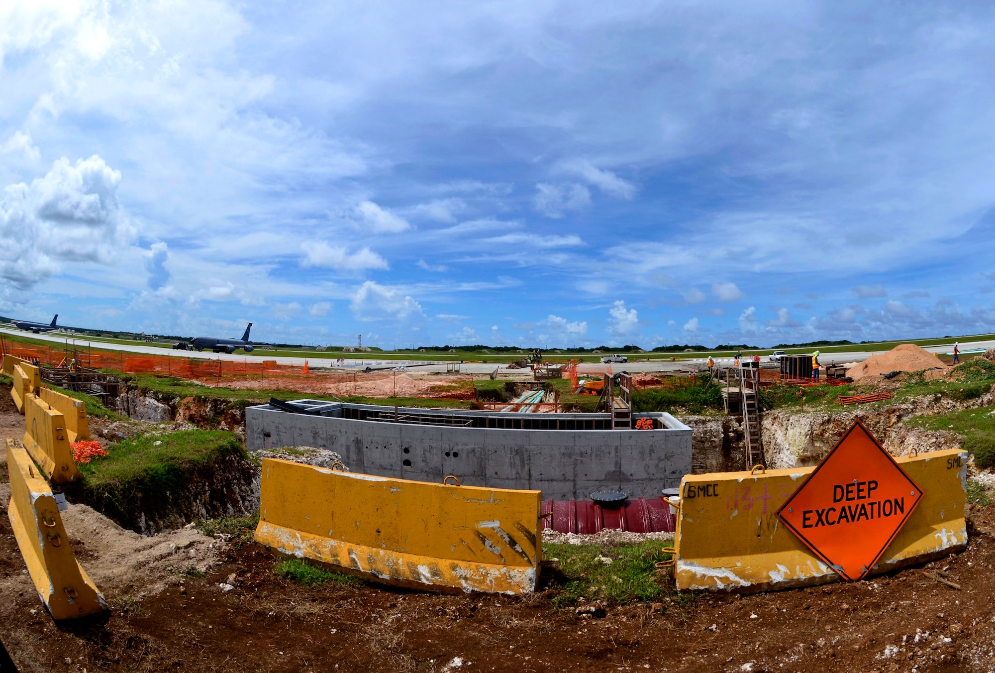 Construction of the Guam Strike Clear Water Rinse Facility continues Sept. 5, 2013, on the Andersen Air Force Base, Guam, flightline. Department of Defense contractors and members of the 36th Civil Engineer Squadron began construction of the Guam Strike Clear Water Rinse Facility, or the “birdbath,” in May 2013 and are scheduled to complete the facility by December of this year. (U.S. Air Force photo by Senior Airman Marianique Santos/Released)
