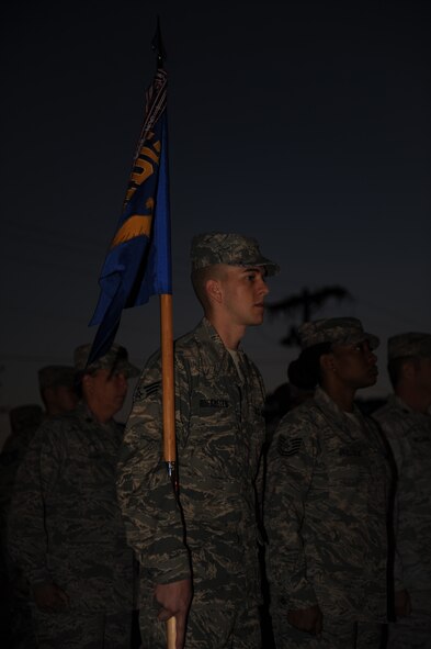 U.S. Air Force Senior Airman Christian Roebbelen, 7th Medical Operations Squadron, holds the squadron guidon during an open ranks inspection Sept. 5, 2013, at the medical facility on Dyess Air Force Base, Texas. The 7th Medical Group commander, Col. Robert Bogart, held an open ranks inspections to help get Airmen “back to militay basics”. (U.S. Air Force photo by Airman 1st Class Alexander Guerrero/Released)