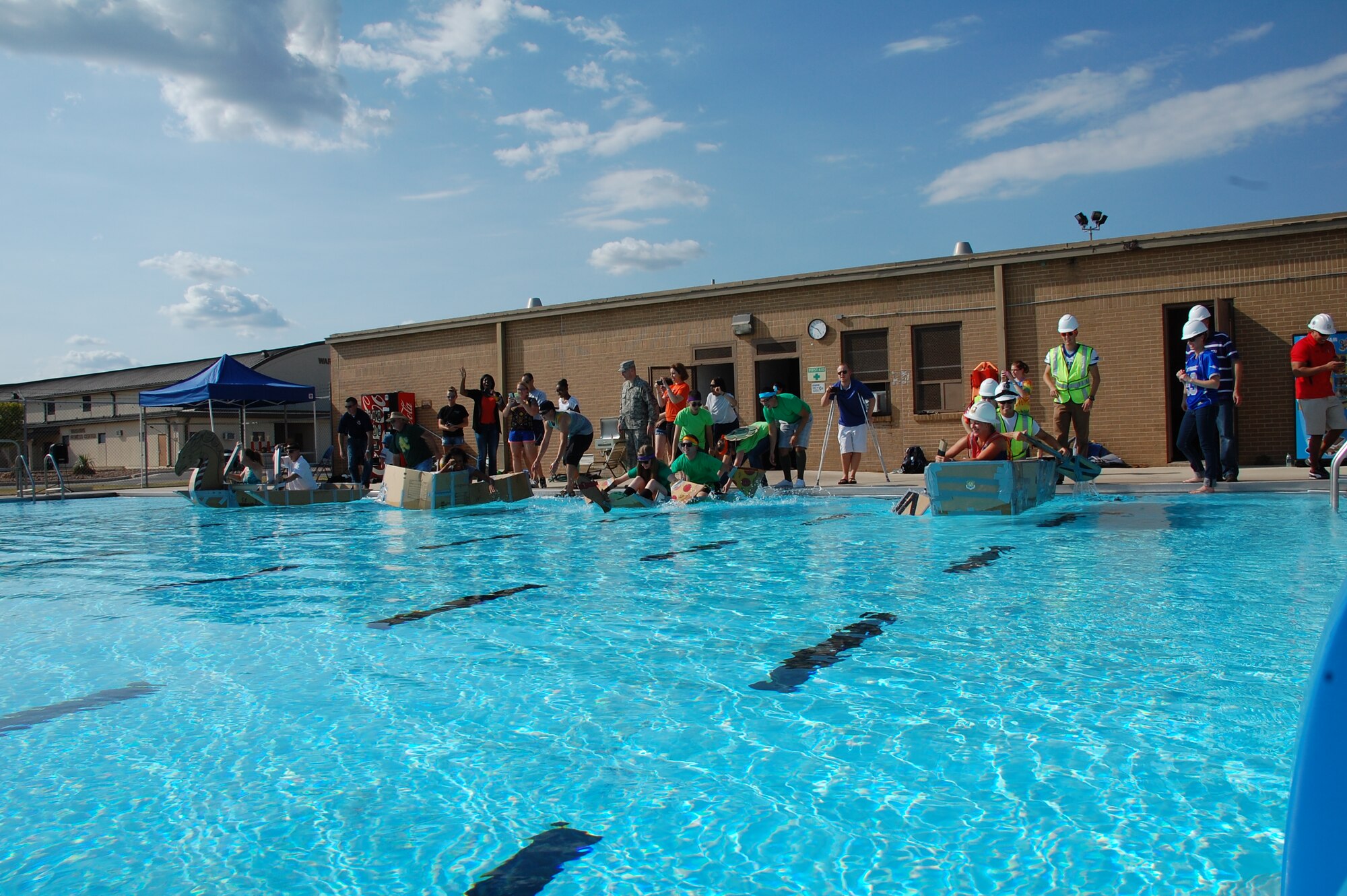 JOINT BASE SAN ANTONIO-LACKLAND, Texas  -- After a quick seaworthiness test, all of the boats are on their way across the 25-meter Warhawk pool. (U.S. Air Force photo/Debbie Aragon)