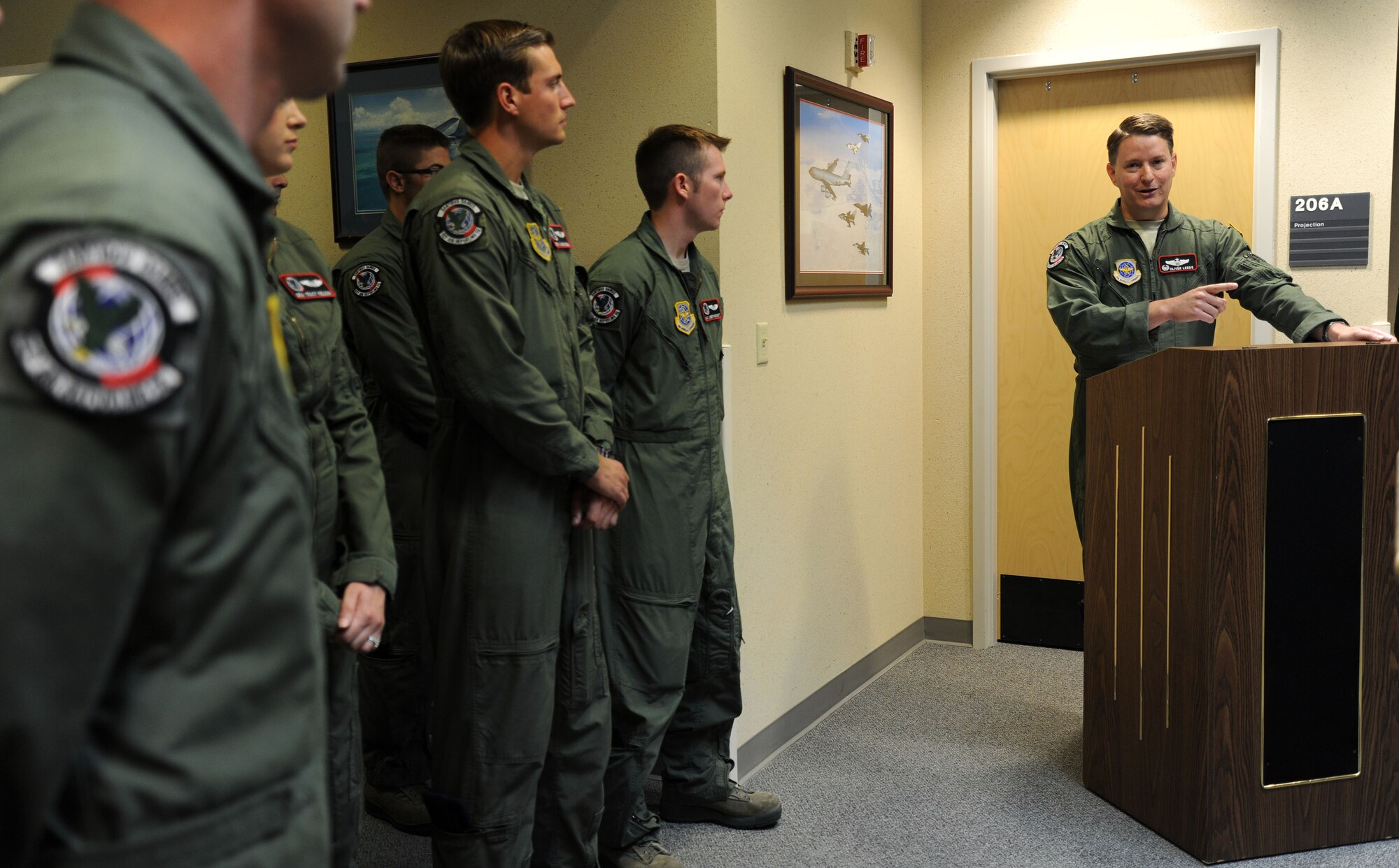 Lt. Col. Oliver Leeds, 92nd Air Refueling Squadron commander, speaks about Col. Gerrald M. Vivian, the pilot to deliver the first KC-135 Stratotanker to Fairchild, during the renaming ceremony of the 92nd ARS auditorium at Fairchild Air Force Base, Wash., Sept. 5, 2013. The 92nd ARS acknowledged the pioneering character of Vivian along with a ribbon cutting of a heritage display. (U.S. Air Force photo by Airman 1st Class Janelle Patiño/Released)