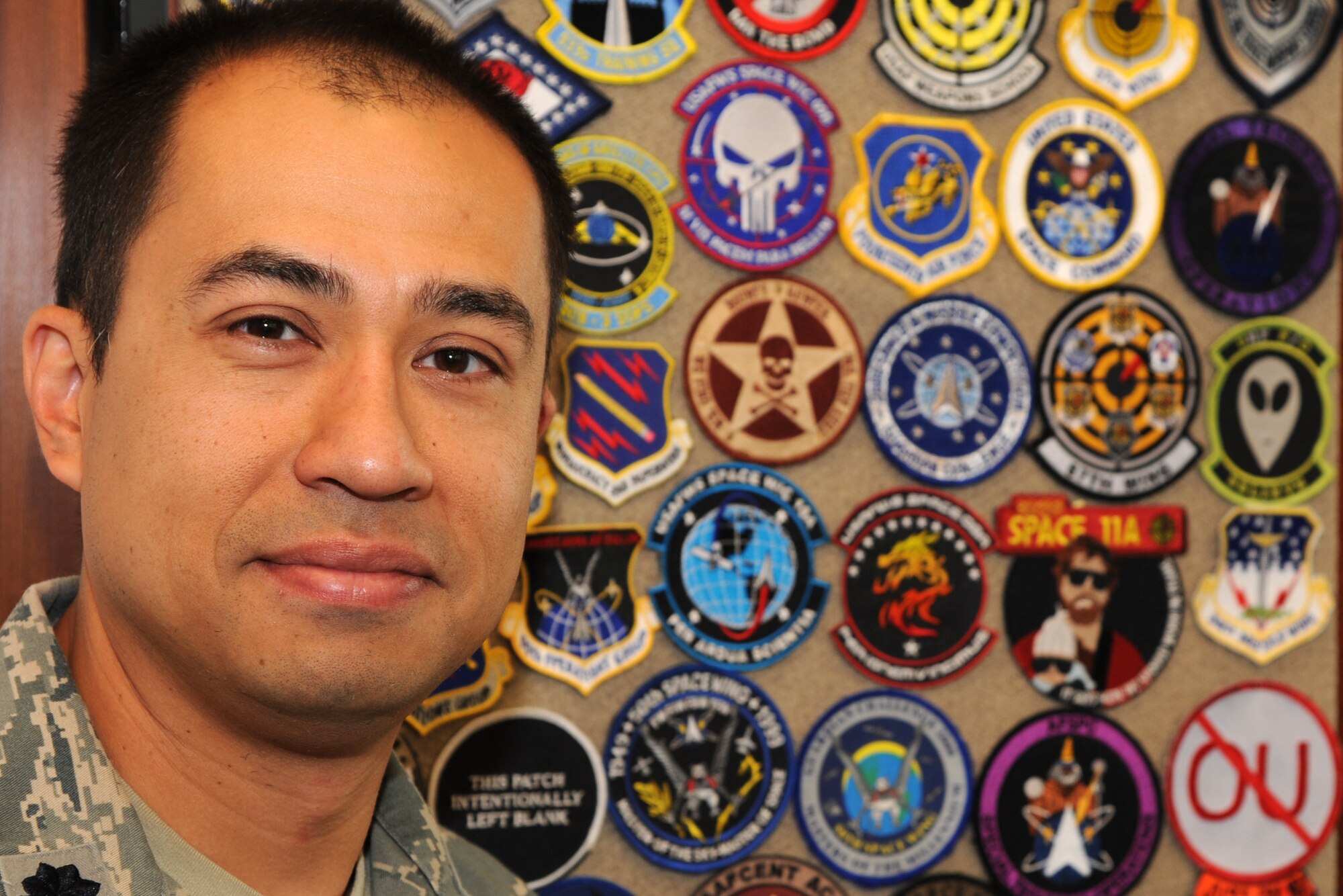 PETERSON AIR FORCE BASE, Colo. – Lt. Col. Rich Operhall shows off a portion of his collection of more than 15,000 patches. Operhall began collecting patches in junior high and says his collection fuels his passion of Air Force history and heritage. Operhall said this passion is not as much about the patches as it is the stories and the people who make the Air Force work day-to-day. (U.S. Air Force photo/Staff Sgt. J. Aaron Breeden)