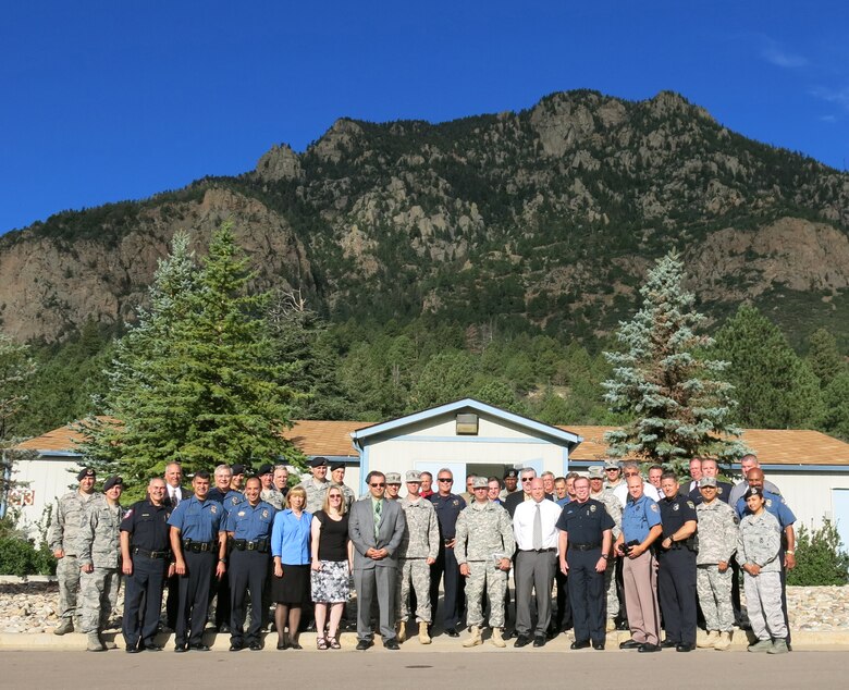 CHEYENNE MOUNTAIN AIR FORCE STATION, Colo. – Police chiefs and other law enforcement department heads from around the Pikes Peak Region pose for a group photo at the base of Cheyenne Mountain after concluding the monthly Police Collaborative meeting, which was held for the first time at CMAFS. (U.S. Air Force photo/Michael Golembesky)