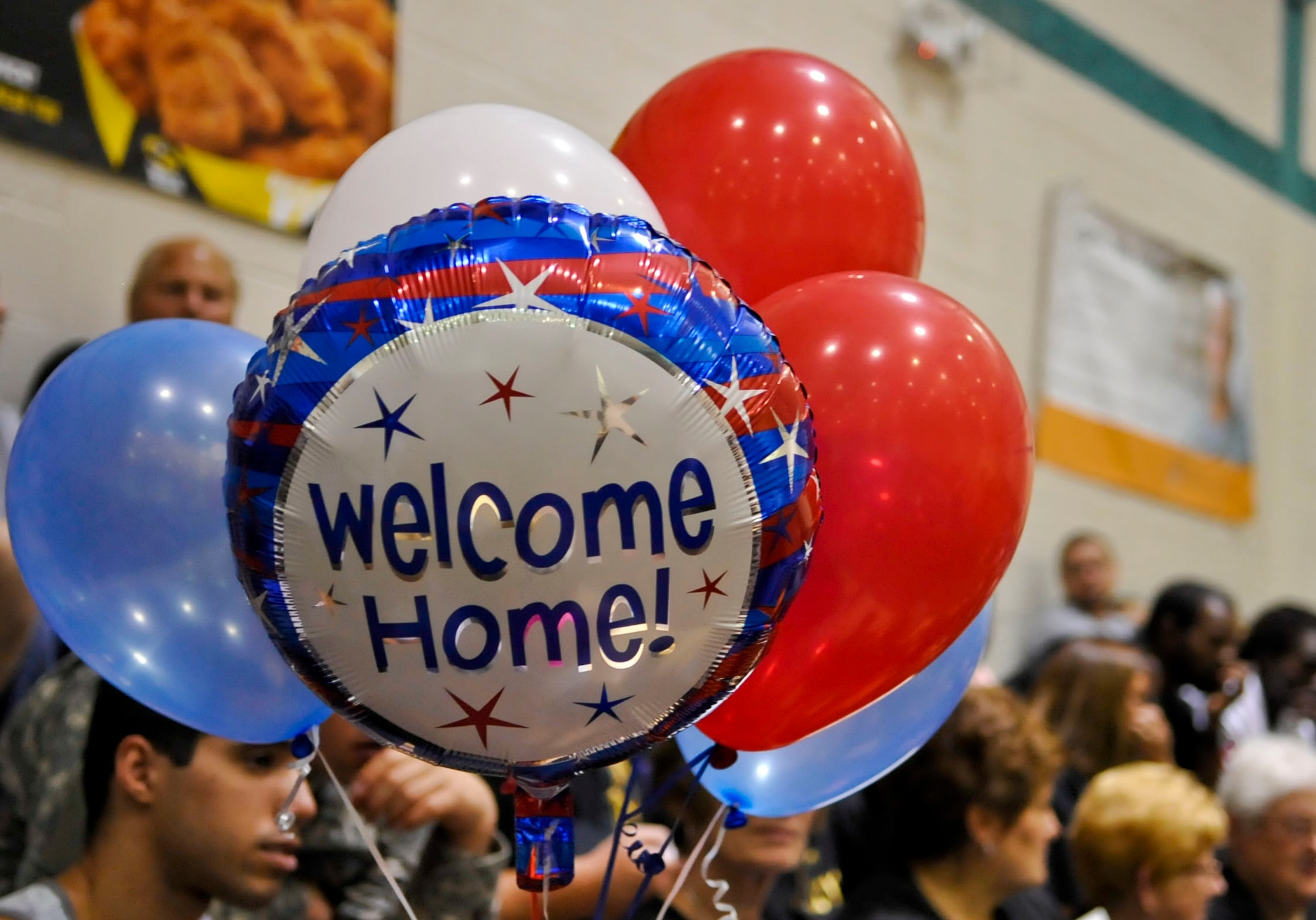 Family members and Soldiers await the return of the 359th Inland Cargo Transfer Company during a welcome-home ceremony at Fort Eustis, Va., Sept. 9, 2013. The 359th ICTC recently completed a nine-month tour in Afghanistan. (U.S. Air Force photo by Staff Sgt. Wesley Farnsworth/Released)