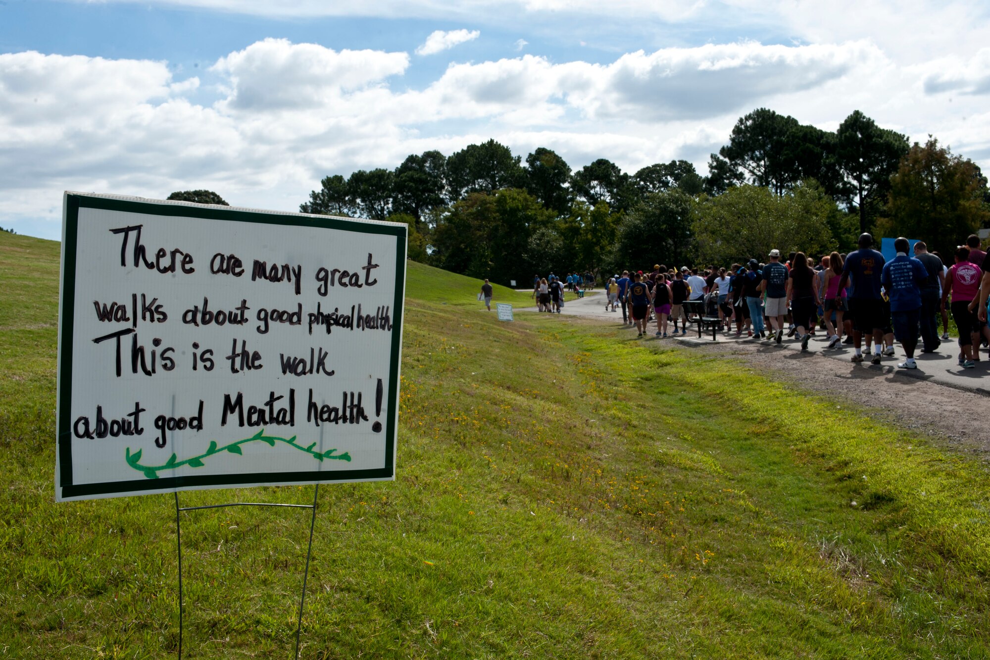 Signs mark the walking path during the Out of Darkness suicide awareness walk in Virginia Beach, Va., Sept. 7, 2013. Each sign displayed a message about the event and suicide prevention. (U.S. Air Force photo by Staff Sgt. Stephanie Rubi/Released)