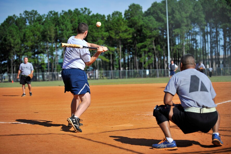 U.S. Army Soldiers and U.S. Air Force Airmen play a game of softball during the 20th Mission Support Group Warrior Challenge, Shaw Air Force Base, S.C., Sept. 6, 2013. The 20th MSG Warrior Challenge, a day-long event meant to boost morale between Airmen and Soldiers, included softball, tug of war, a watermelon eating contest and other events to build camaraderie.  (U.S. Air Force photo by Airman 1st Class Jensen Stidham/Released)