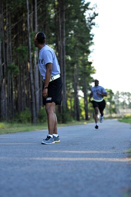 U.S. Army Soldiers run a relay race during the 20th Mission Support Group Warrior Challenge, Shaw Air Force Base, S.C., Sept. 6, 2013.  The 20th MSG Warrior Challenge, a day-long event meant to boost morale between Airmen and Soldiers, included softball, tug of war, a watermelon eating contest and other events to build camaraderie.  (U.S. Air Force photo by Airman 1st Class Jensen Stidham/Released)