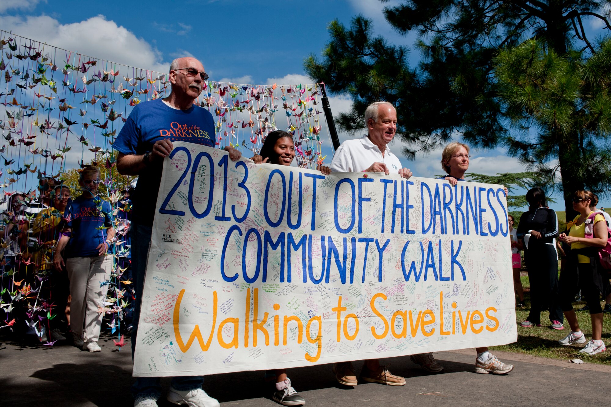 Participants begin the Out of Darkness suicide awareness walk in Virginia Beach, Va., Sept. 7, 2013. After the walk, participants could seek counseling for depression or coping with the loss of a loved one.  (U.S. Air Force photo by Staff Sgt. Stephanie Rubi/Released) 