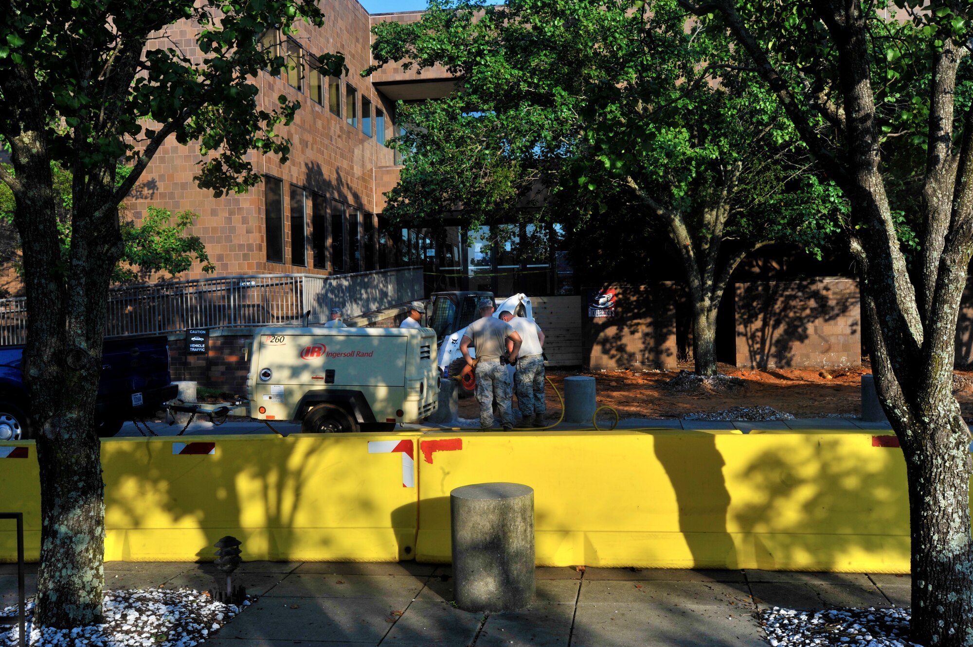 U.S. Air Force Airmen from the 20th Civil Engineer Squadron begin construction on uneven sidewalks, Shaw Air Force Base, S.C., Sept. 3, 2013.  Construction started at the 20th Force Support Squadron building to avoid tripping hazards for patrons and employees entering the facility. (U.S. Air Force photo by Airman 1st Class Jensen Stidham/Released)