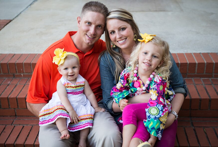 From left, Piper Wilhide, 1 year old, U.S. Air Force Tech. Sgt. Randy Wilhide, 4th Equipment Maintenance Squadron Assistant NCO in-charge of precision-guided munitions, Haleigh Wilhide and Conleigh Wilhide, 4 years old, pose for a family portrait in North Carolina, June 20, 2013. The family’s lives changed Oct. 17, 2012, when, at four-weeks-old, Piper was diagnosed with Neuroblastoma, a disease in which cancer cells form in nerve tissue of the adrenal gland, neck, chest or spinal cord. (Courtesy photo)
