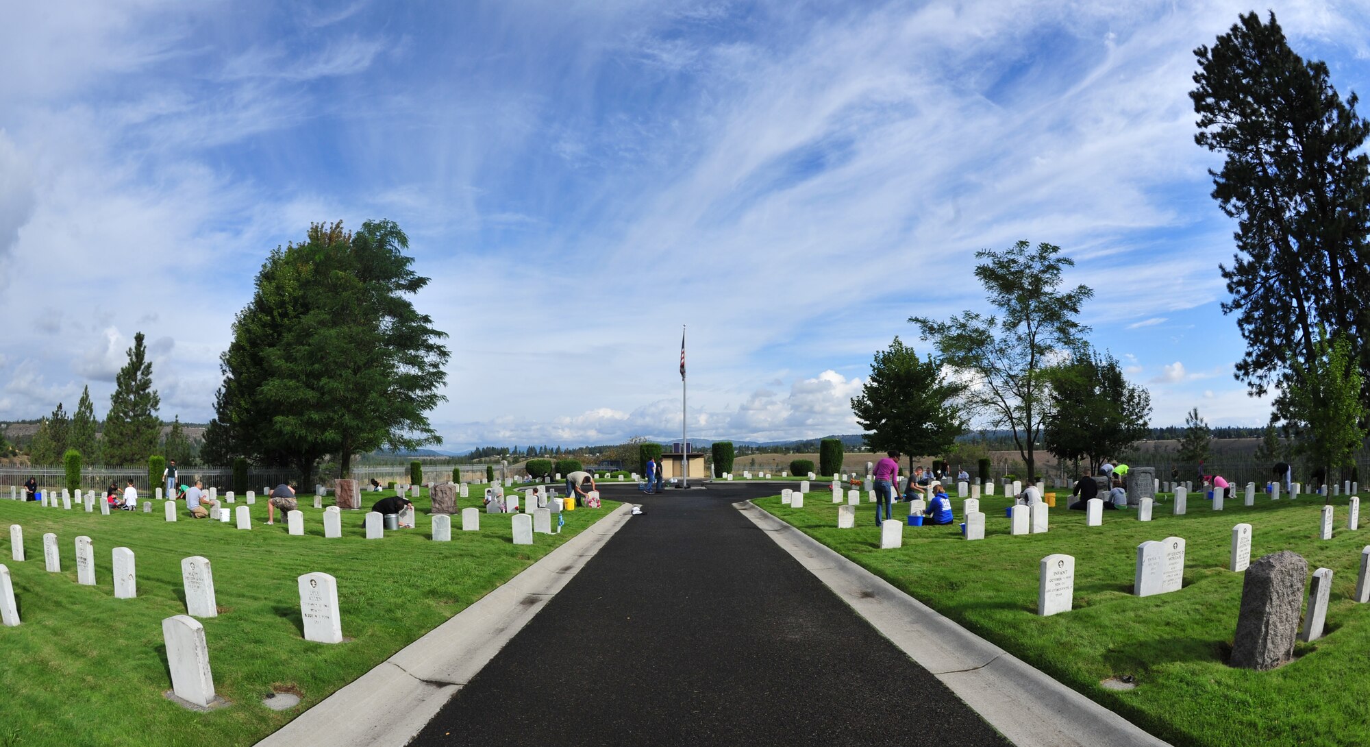 Members of Team Fairchild participate in a beautification project at Fort George Wright cemetery at Spokane, Wash., Sept. 7, 2013. The Airmen were cleaning the cemetery as part of a beautification project in preparation for Patriot Day celebrations. (U.S. Air Force photo by Senior Airman Taylor Curry/Released)