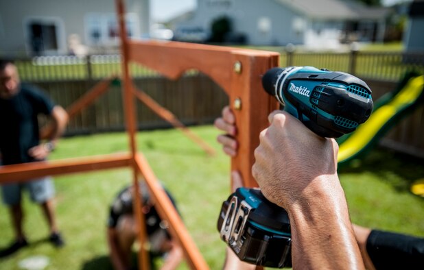 Airmen from the 628th Security Forces Squadron military working dog handlers build a swing set for a deployed Wingman’s daughter. Staff Sgt. Kyle Shaughnessy, 628th SFS MWD handler, is currently deployed to Southwest Asia. His fellow Airmen built the swing set in accordance with the Day of Caring events throughout Joint Base Charleston, where approximately 2,500 service members from the base participated in the Trident United Way’s Day of Caring, volunteering their skills to assist with more than 50 projects in the local community. The base held their volunteer events a week earlier than Trident the Day of Caring, due to operational commitments including the delivery of the final U.S. Air Force C-17 Globemaster III. (U.S. Air Force Photo / Senior Airman Tom Brading)
