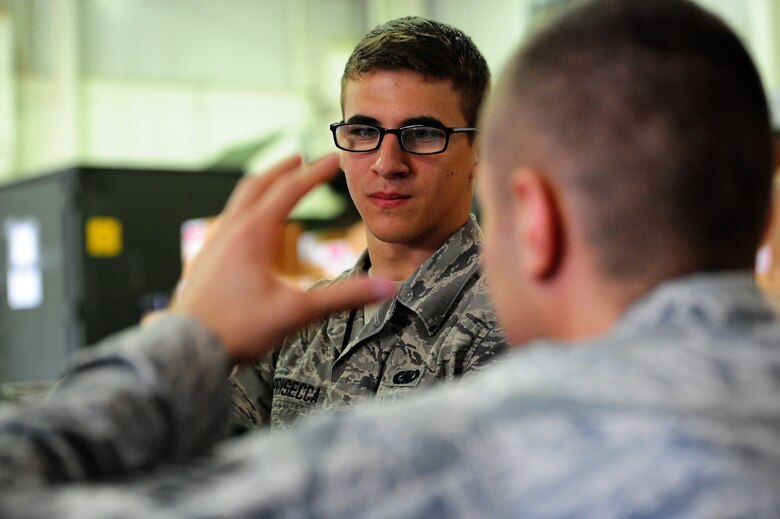 U.S. Air Force Airman 1st Class Eric Caprisecca, 509th Logistics Readiness Squadron aircraft parts journeyman, receives training from U.S. Air Force Staff Sgt. Anton Auster, 509th LRS aircraft part store supervisor, on annotating a piece of equipment in the aircraft part store at Whiteman Air Force Base, Mo., Aug. 2, 2013. Aircraft parts journeymen use a computer system called Enterprise Supply Solution to keep accountability of the shop’s parts. (U.S. Air Force photo by Staff Sgt. Nick Wilson/Released)