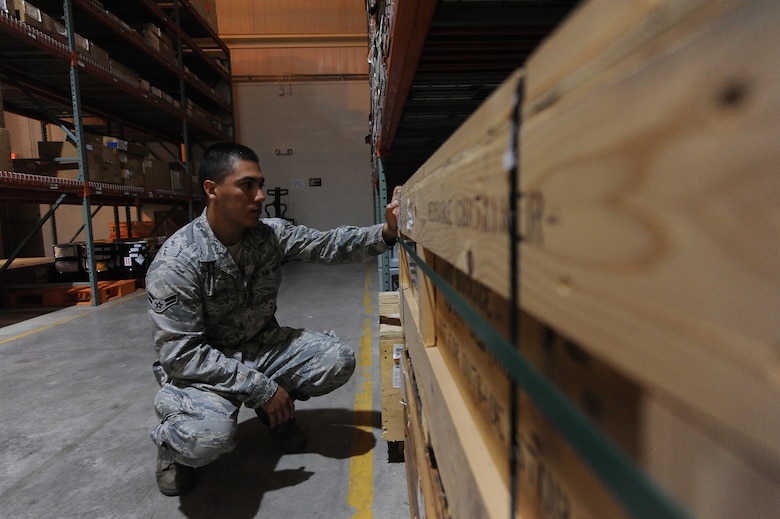 U.S. Air Force Senior Airman Emmanuel Arroyo, 509th Logistics Readiness Squadron aircraft part store journeyman, verifies the stock number of a part at the aircraft part store at Whiteman Air Force Base, Mo. Aug. 2, 2013. The stock numbers on items help Airmen quantify and maintain accountability of parts stored in the aircraft part store. (U.S. Air Force photo by Staff Sgt. Nick Wilson/Released)
