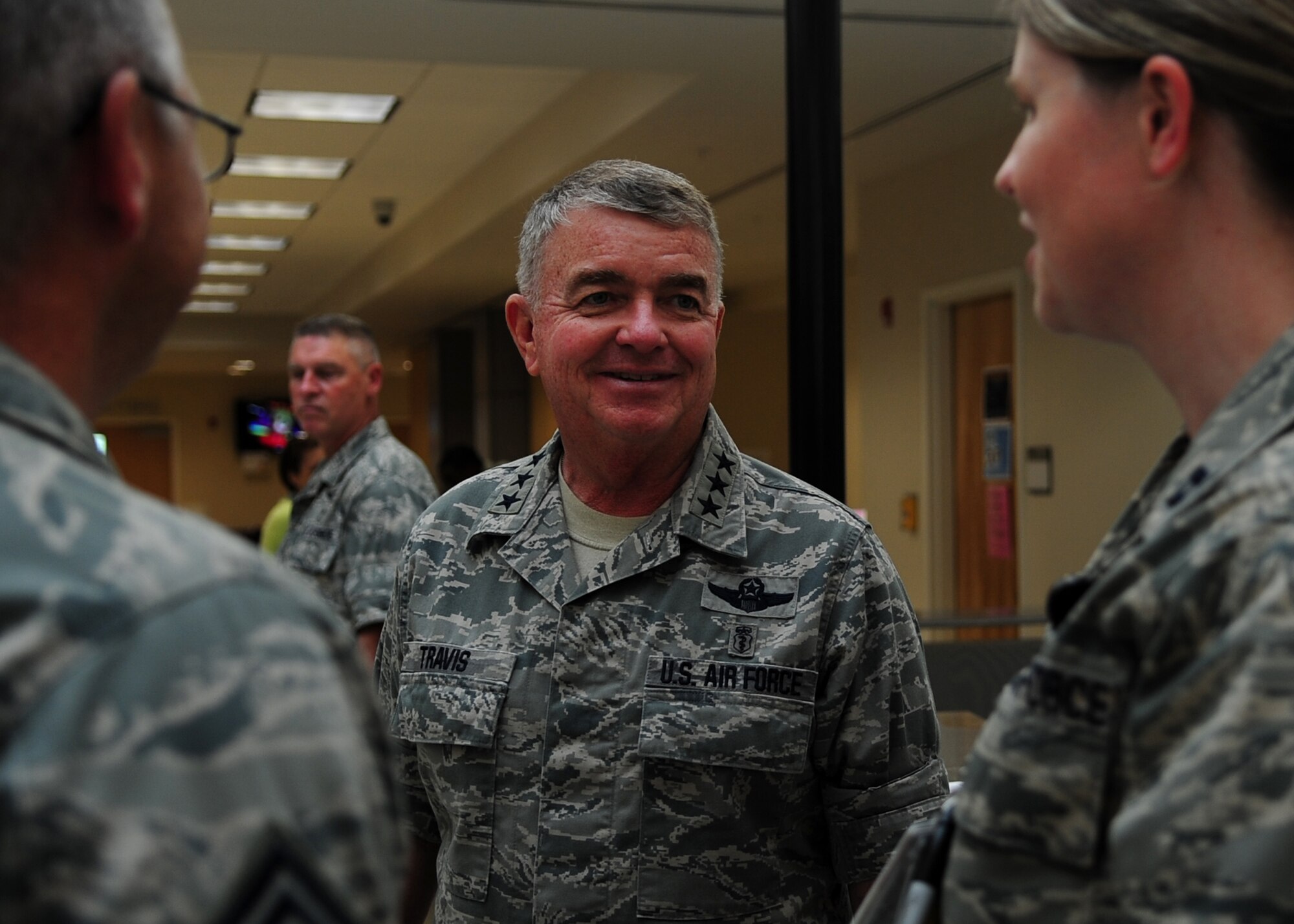 U.S. Air Force Lt. Gen. Thomas Travis, surgeon general of the Air Force, speaks with Airmen at U.S. Air Force Hospital Langley on Langley Air Force Base, Va., Sept. 9, 2013. Travis visited clinics including the Dental Clinic, Family Health and the Intensive Care Unit. Additionally, he hosted an all-call with members of the 633rd Medical Group, where he discussed changes in the medical career field and matters affecting medical personnel. (U.S. Air Force photo by Airman Areca T. Wilson)