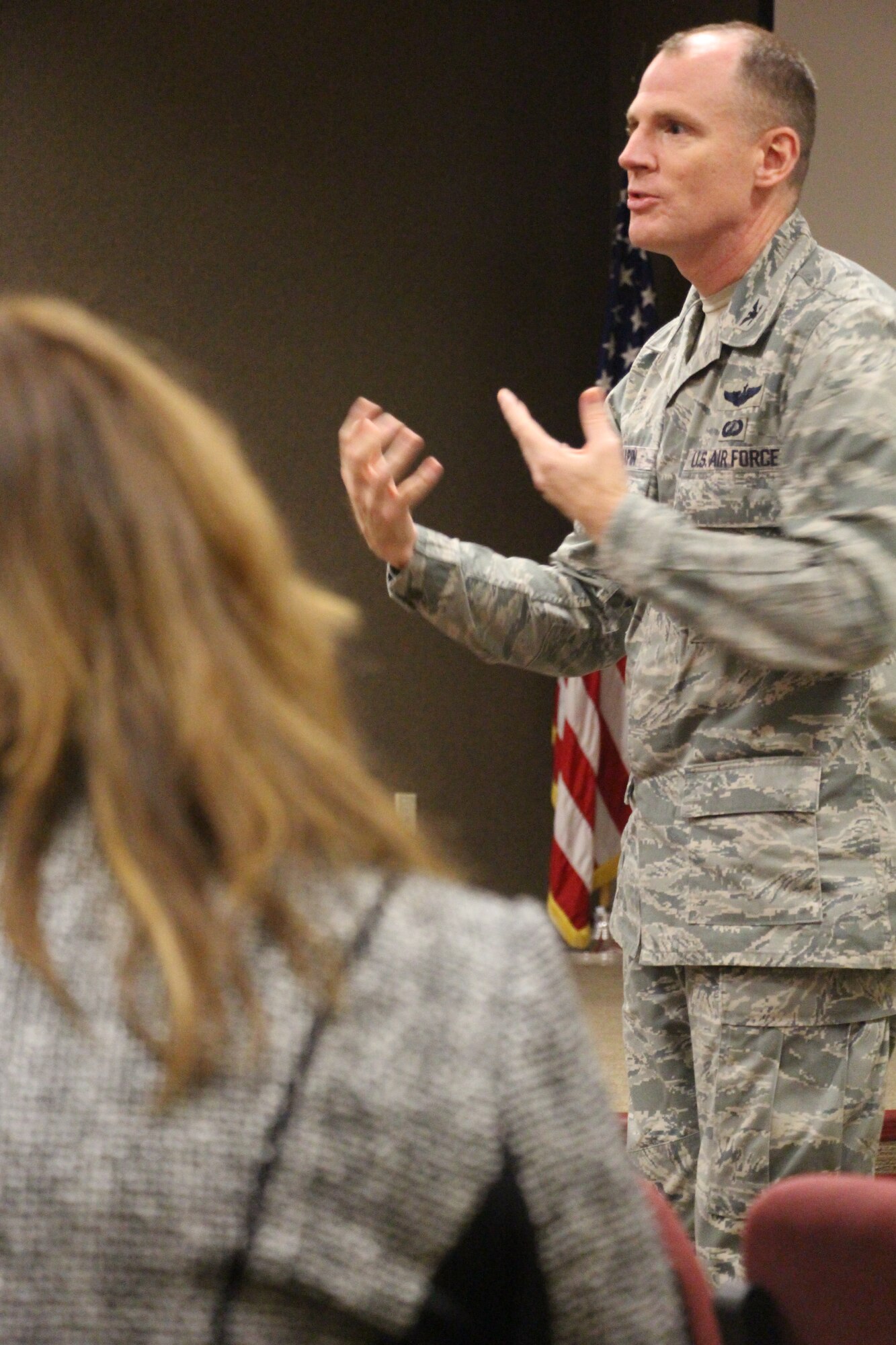 JOINT BASE MCGUIRE-DIX-LAKEHURST, N.J – Col. Martin Chapin, 621st Contingency Response Wing commander, delivers a mission brief at the 819th Global Support Squadron auditorium to the spouses of CRW Airmen during a Spouse’s Orientation Day, Sep. 6, 2013. This event introduced the spouses to one another and provided an inside look at 621 CRW operations. (U.S. Air Force photo by Senior Airman Destinie M. Chavez/released)