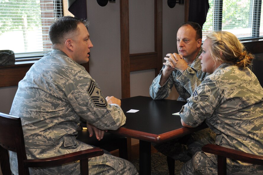 916th ARW Command Chief Master Sgt. James Loper (left) chats with Senior Master Sgt. Steven Bender, 916th Recruiting Flight chief; and Senior Airman Nicole Rose, 916th Crew Communications Office, during a recent speed mentoring session.  About a dozen wing members recently took part in this fast-paced career enhancing event. (USAF photo by SSgt. Mark Thompson, 916ARW/PA)