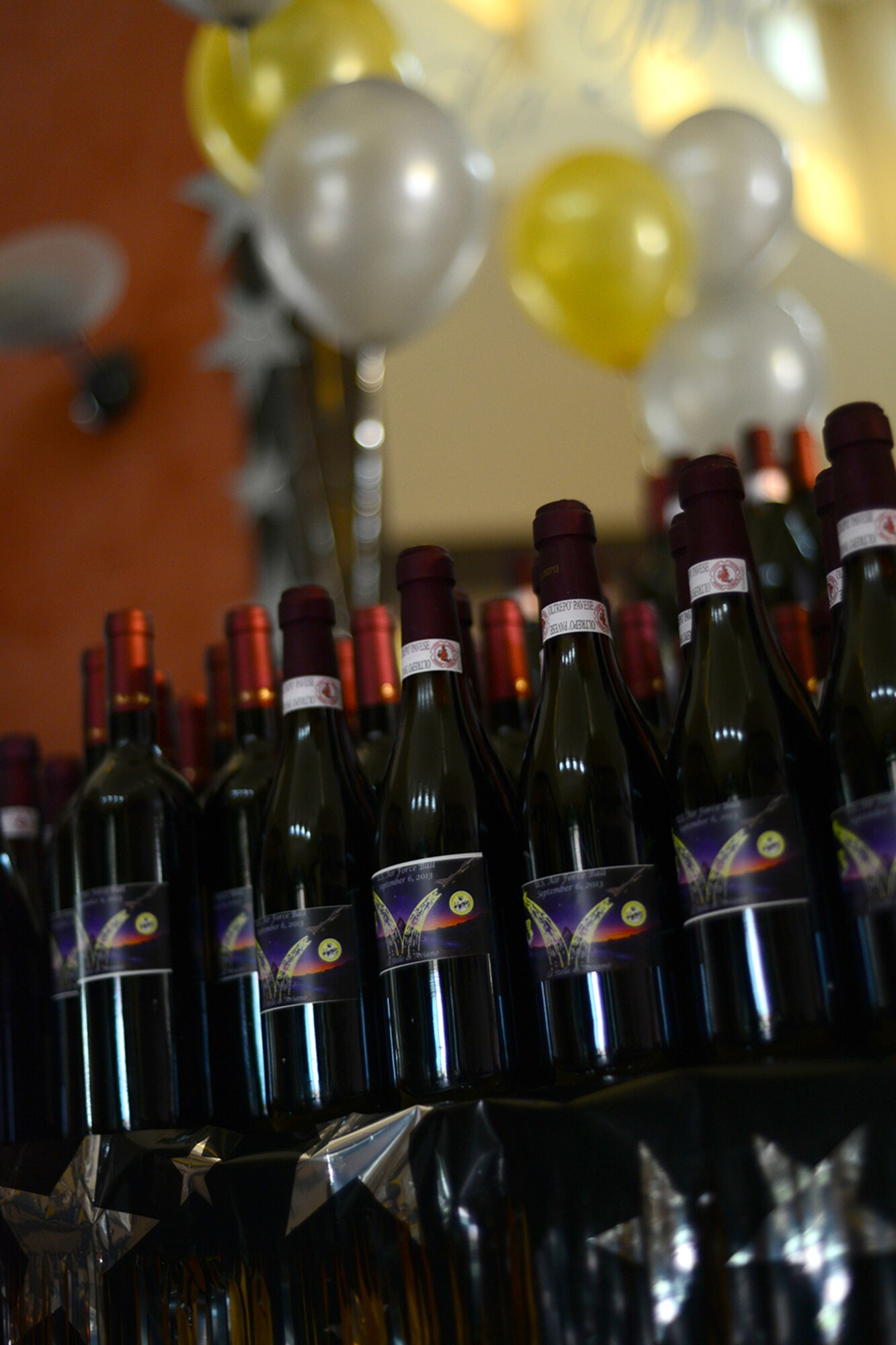 Bottles of wine labeled with the theme “Stars of Aviano” line the entryway of the Aviano Air Force Ball Sept. 6, 2013, at Aviano Air Base, Italy. Originally part of the U.S. Army, the U.S. Air Force became a separate branch on Sept. 18, 1947. (U.S. Air Force photo/Senior Airman Michael Battles)