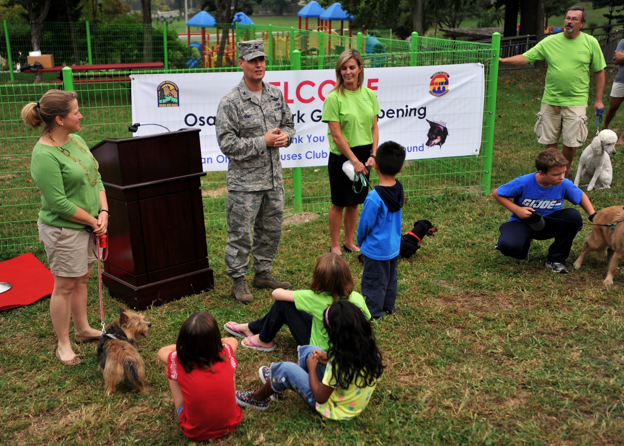 Col. Sean DeWitt, 51st Fighter Wing vice commander, speaks before the grand opening of the dog park at Osan Air Base, Republic of Korea, Sept. 9, 2013. The dog park is fully enclosed with a double-gated entry, and features several benches and a gazebo that provides a cool, shady respite for visitors. (U.S. Air Force photo/ Senior Airman Siuta B. Ika)