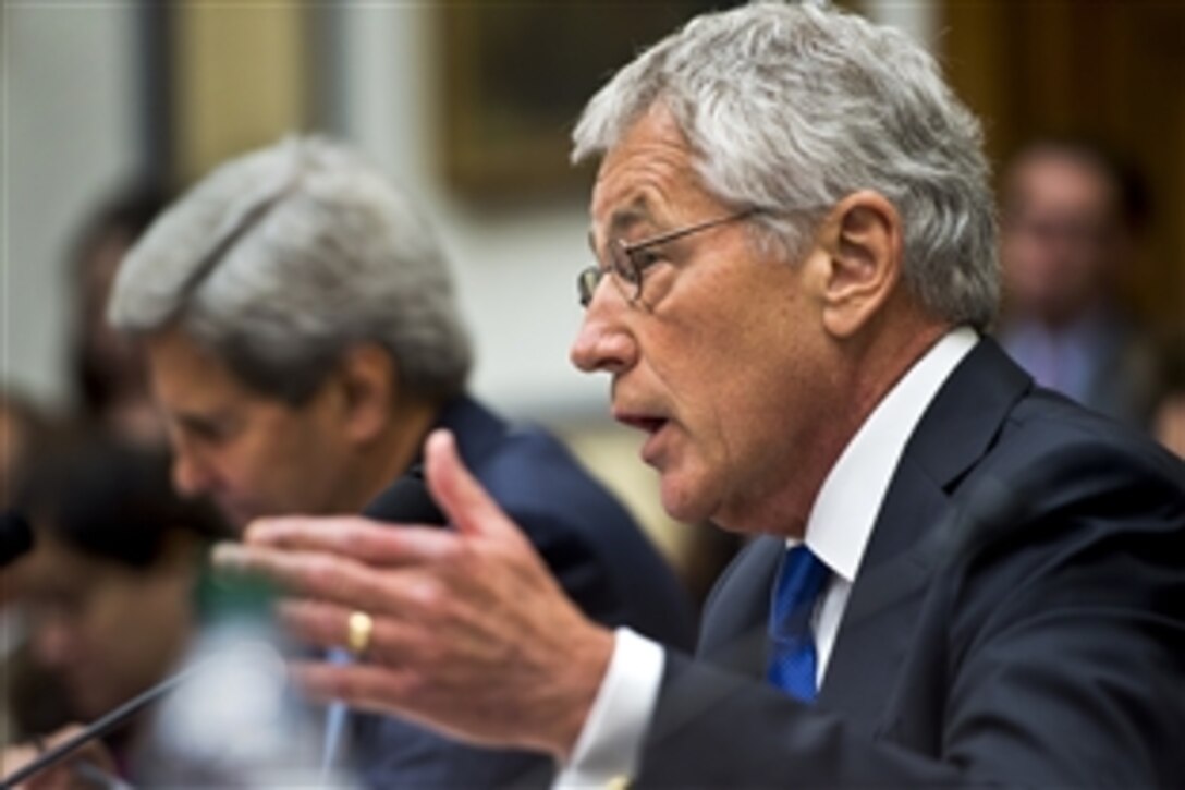 Defense Secretary Chuck Hagel testifies about the possible use of U.S. military force in Syria before the House Armed Services Committee in Washington, D.C., Sept. 10, 2013. Secretary of State John F. Kerry, left, and Army Gen. Martin E. Dempsey, (not pictured) chairman of the Joint Chiefs of Staff, joined Hagel.
