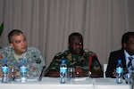 Maj. Damon Lacour, Missouri Army National Guard, and Maj. Isaac Sendi,Tanzania People Defence Force, attend a training session on countering violent extremism during Eastern Accord 2012.