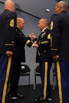 Command Sgt. Maj. Brunk Conley, the 10th command sergeant major of the Army National Guard, accepts the noncommissioned officers sword from Army Lt. Gen. William E. Ingram Jr., director of the Army National Guard, symbolically taking on the responsibilities of his new position in a ceremony at the Army National Guard Readiness Center in Arlington, Va., Sept. 26, 2012.