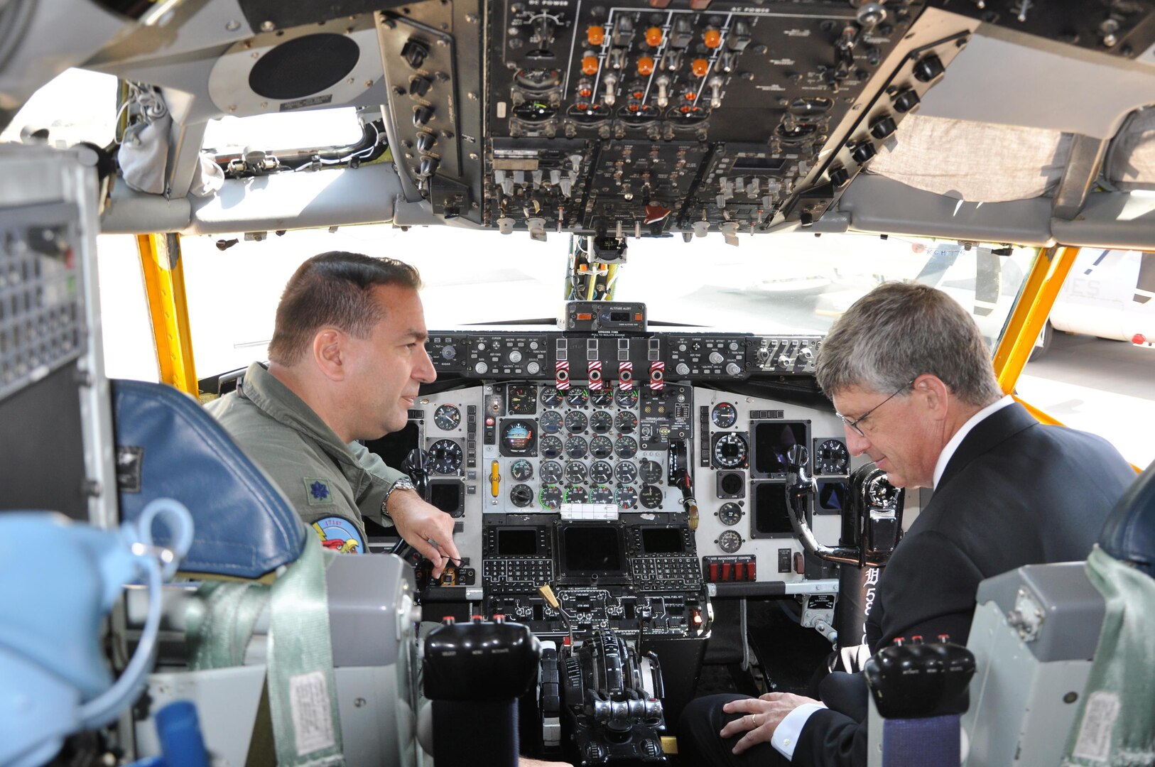 U.S. Ambassador to South Africa Donald H. Gips sits in a KC135T Stratotanker cockpit with Michigan Air National Guard aircraft commander Lt. Col. Paul Beck, Sept. 19, 2012. The two discussed the aircraft’s mission and capabilities during the opening day of the 2012 Africa Aerospace and Defense Airshow and Exhibition.