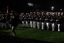 The Marine Corps Silent Drill Platoon performs a more than 10-minute-long drill session during the 8th and I Evening Parade, Aug. 23. The Marines stay in sync with one another despite the lack of any sound or drill execution calls. 