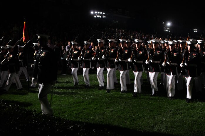 The Marine Corps Silent Drill Platoon performs a more than 10-minute-long drill session during the 8th and I Evening Parade, Aug. 23. The Marines stay in sync with one another despite the lack of any sound or drill execution calls. 