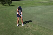 Capt. Leslie Harkness, Headquarters and Headquarters Squadron adjutant, attempts a put from just outside the green during the Commander's Cup Golf Tournament, Aug. 27.