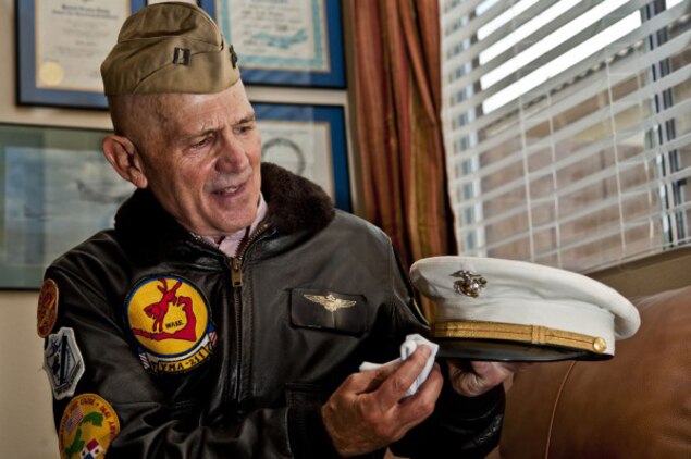 Retired Air Force Col. (Dr.) James Ruffer wipes off his Marine Corps cover at his home in Summerlin, Nev. Ruffer served in the Air Force, Marines and the Navy throughout his 26 year military career.