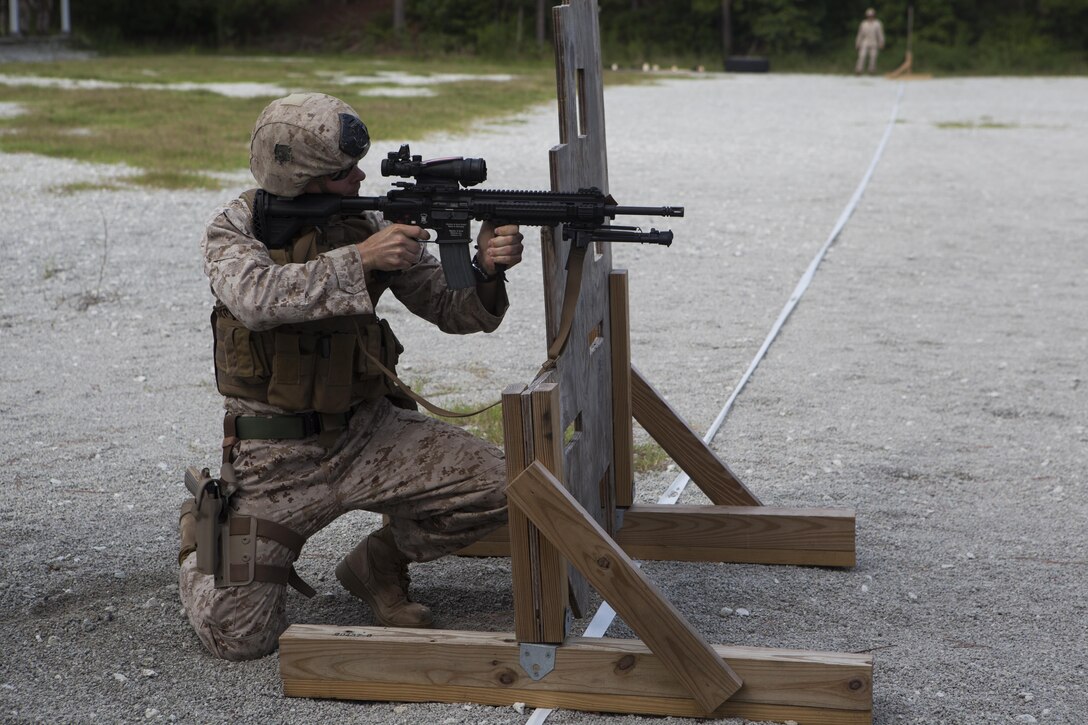 A Marine with Weapons Training Battalion, shoots the Infantry Automatic Rifle during a shooting competition at Stone Bay Rifle Range, a satellite installation of Marine Corps Base Camp Lejeune, Sept. 5. Weapons Training Battalion and 2nd Reconnaissance Battalion trained with the M4, M27 and Colt M1911 .45 caliber pistol the week of Sept. 2. 