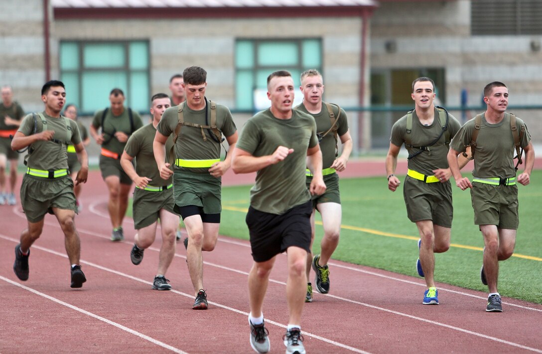 Marines with Combat Logistics Regiment 17, 1st Marine Logistics Group, conduct physical training held in memory of the heroes of 9/11 aboard Camp Pendleton, Calif., Sept. 11, 2013. The Marines performed circuit exercises over a 20-minute period and concluded with speeches by various staff members to remember those who have fought and served to protect the country. 