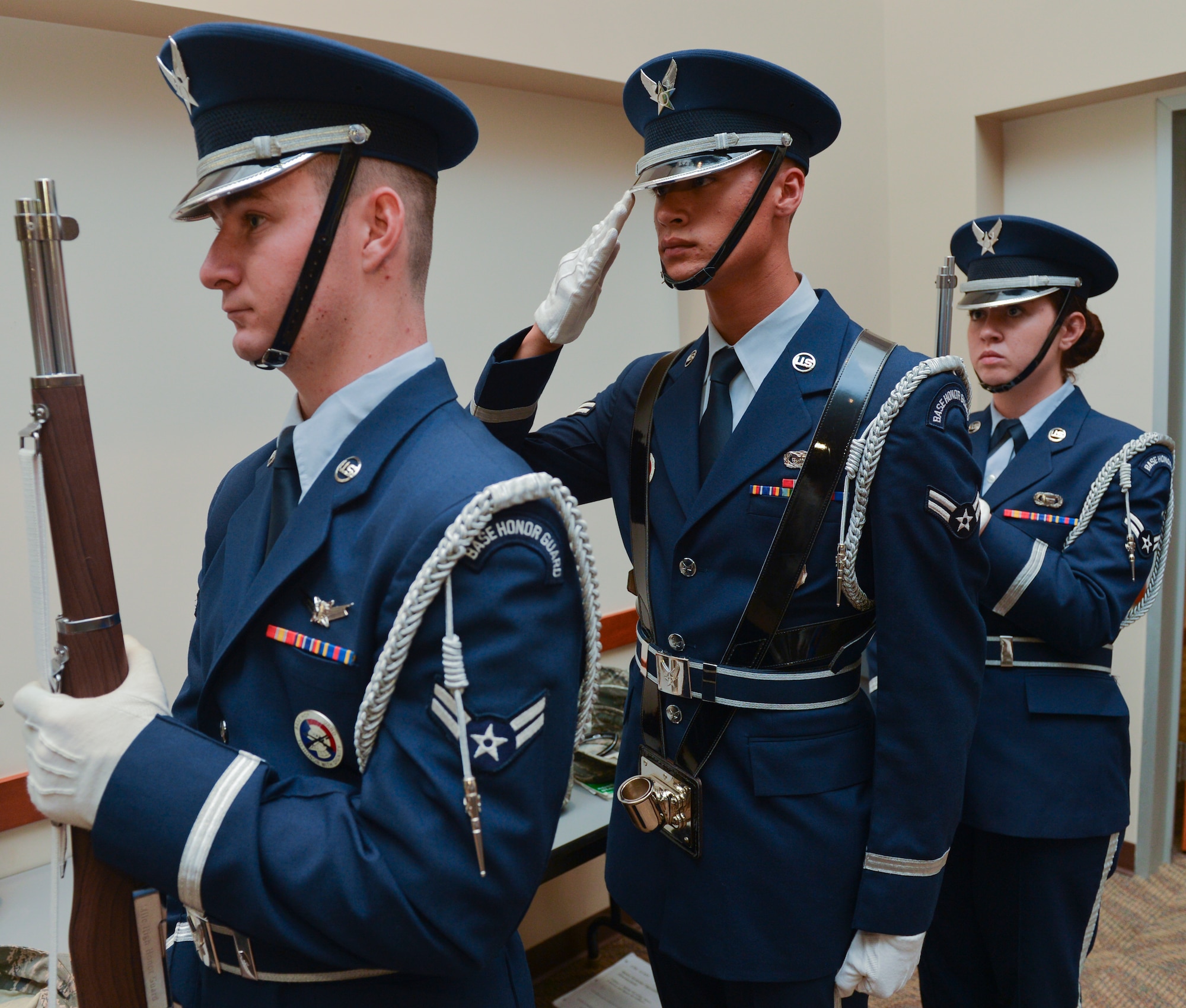 Members of the Mile High Honor Guard render a salute during the Patriot Day and National Day of Remembrance retreat ceremony Sept. 11, 2013, at the Leadership Development Center on Buckley Air Force Base, Colo. The ceremony honored the lives lost 12 years ago in the 9/11 terrorist attacks. (U.S. Air Force photo by Staff Sgt. Paul Labbe/Released)