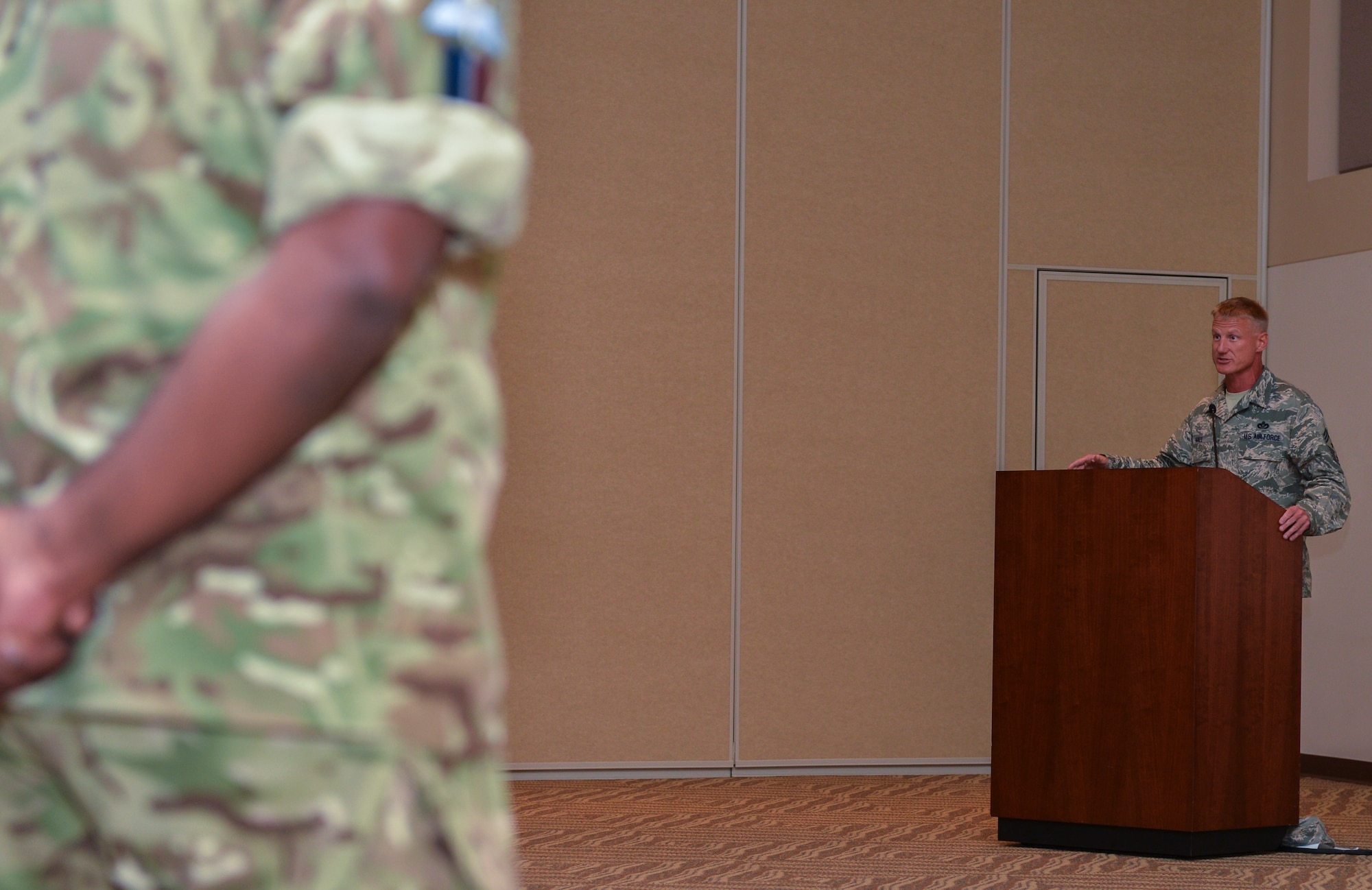 Chief Master Sgt. Craig S. Hall, 460th Space Wing command chief, gives closing remarks during the Patriot Day and National Day of Remembrance Sept. 11, 2013, at the Leadership Development Center on Buckley Air Force Base, Colo. Nearly 3,000 people were killed during the attacks in New York City and Washington, D.C., including more than 400 police officers and firefighters. (U.S. Air Force photo by Staff Sgt. Paul Labbe/Released)