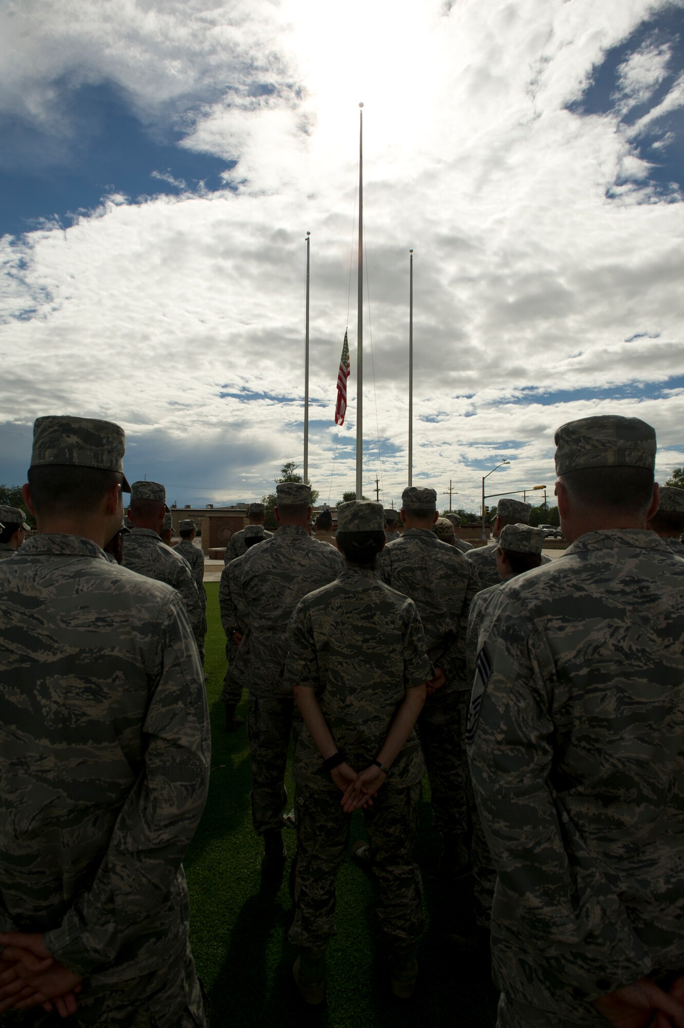 Members of Team Holloman stand at parade rest during the September 11th Remembrance event which took place at Heritage Park at Holloman Air Force Base, N.M., Sept. 11. Col. James Thompson, 49th Wing vice commander, spoke of Holloman’s post-9/11 contributions during the ceremony, including the 16,428 members who have deployed from the 49th Wing since the Sept. 11, 2001 terrorist attacks. (U.S. Air Force photo by Airman 1st Class Chase Cannon/Released)