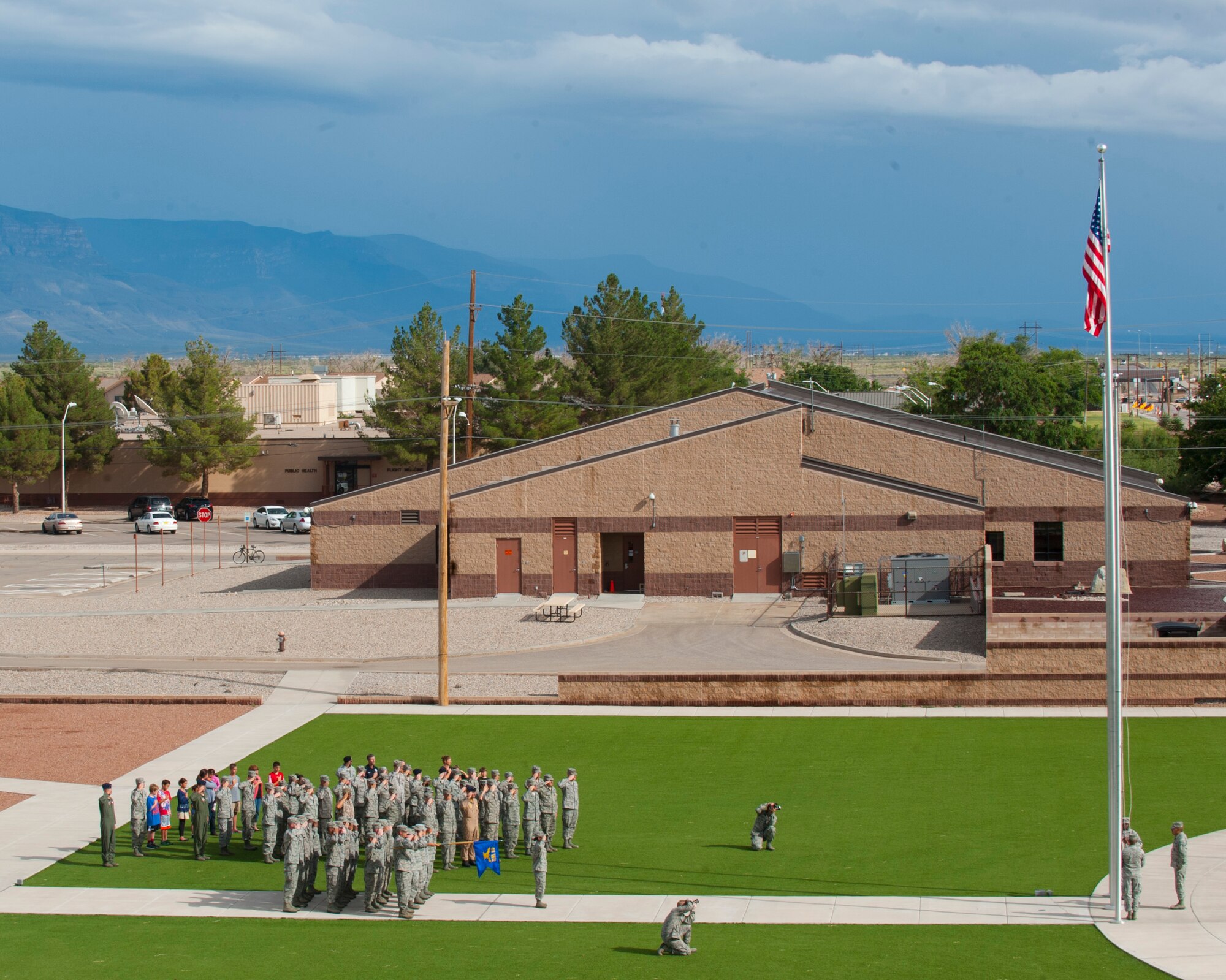 Members of Team Holloman salute the American flag during the September 11th Remembrance event at Holloman Air Force Base, N.M., Sept. 11.During the ceremony, retreat played, honoring the 16,428 members who have deployed from the 49th Wing since the Sept. 11, 2001 terrorist attacks. Col. James Thompson, 49th Wing vice commander, spoke of Holloman’s post-9/11 contributions during the ceremony, which took place at Heritage Park. (U.S. Air Force photo by Airman 1st Class Daniel E. Liddicoet/Released)