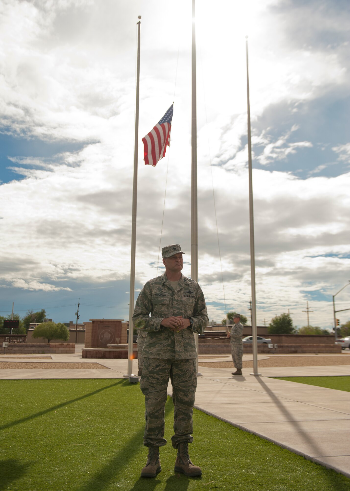 Colonel James Thompson, 49th Wing vice commander, addresses members of Team Holloman during September 11th Remembrance event at Holloman Air Force Base, N.M., Sept. 11. Members of Team Holloman salute the American flag as retreat plays, honoring the 16,428 members who have deployed from the 49th Wing since the Sept. 11, 2001 terrorist attacks. Col. James Thompson, 49th Wing vice commander, spoke of Holloman’s post-9/11 contributions during the ceremony, which took place at Heritage Park. (U.S. Air Force photo by Airman 1st Class Aaron Montoya/Released)