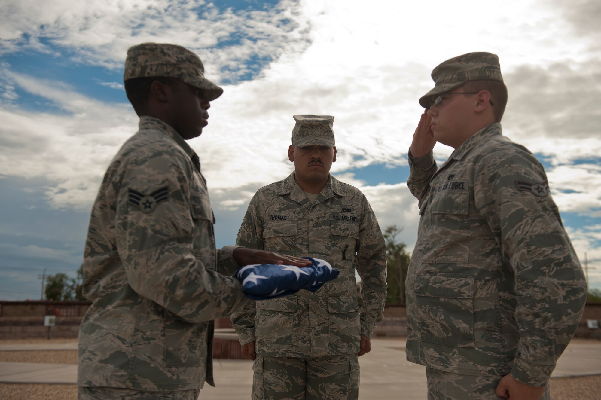 Members of the Holloman Air Force Base Steel Talons Honor Guard salute the flag during the September 11th Remembrance event at Holloman Air Force Base, N.M., Sept. 11. Members of Team Holloman salute the American flag as retreat plays, honoring the 16,428 members who have deployed from the 49th Wing since the Sept. 11, 2001 terrorist attacks Col. James Thompson, 49th Wing vice commander, spoke of Holloman’s post-9/11 contributions during the ceremony, which took place at Heritage Park. (U.S. Air Force photo by Airman 1st Class Aaron Montoya/Released)