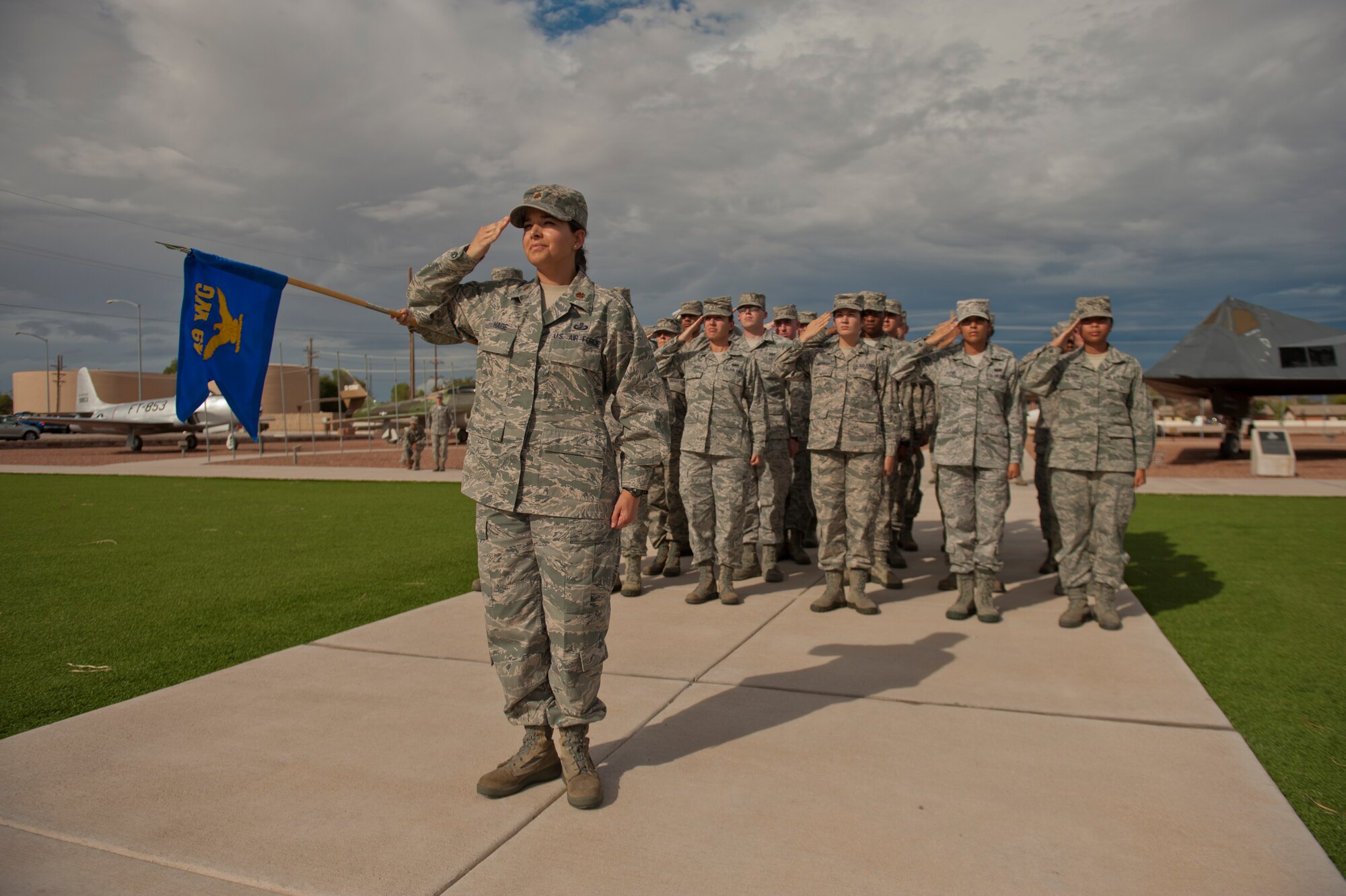 Major Saida Hage, 49th Comptroller Squadron commander, leads her flight during the September 11th Remembrance event at Holloman Air Force Base, N.M., Sept. 11. As retreat plays, members of Team Holloman salute the flag, honoring the 16,428 members who have deployed from the 49th Wing since the Sept. 11, 2001 terrorist attacks. Col. James Thompson, 49th Wing vice commander, spoke of Holloman’s post-9/11 contributions during the ceremony, which took place at Heritage Park. (U.S. Air Force photo by Airman 1st Class Aaron Montoya/Released)