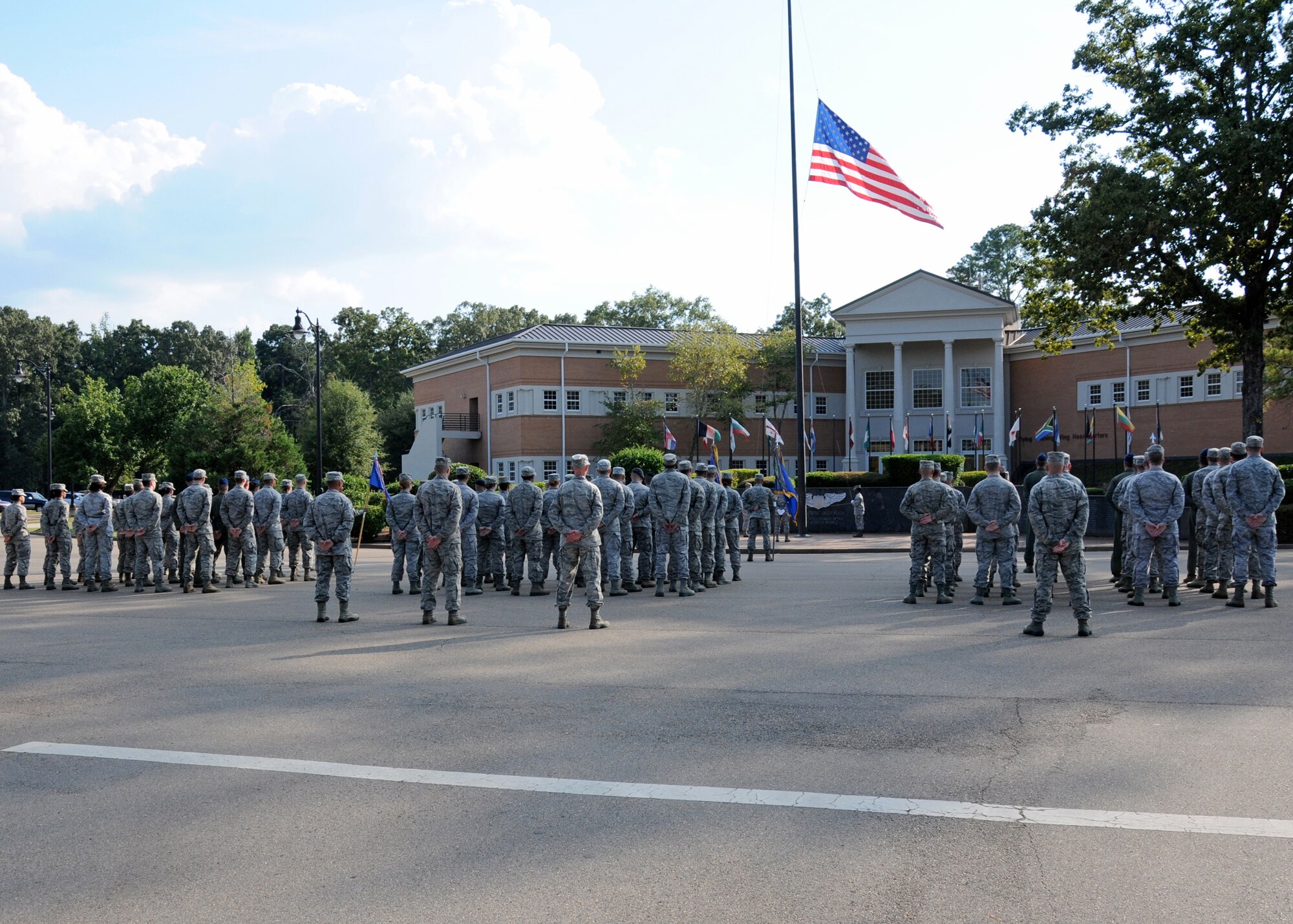Airmen of Columbus Air Force Base stand in formation Sept. 11 at Smith Plaza during a retreat ceremony commemorating Patriot Day.  The ceremony consisted of opening remarks from Col. Jim Sears, 14th Flying Training Wing Commander, an invocation spoken by Maj. Brian McCormack, Chaplain and a formation during the playing of retreat and the National Anthem.  (U.S. Air Force Photo/Sharon Ybarra)