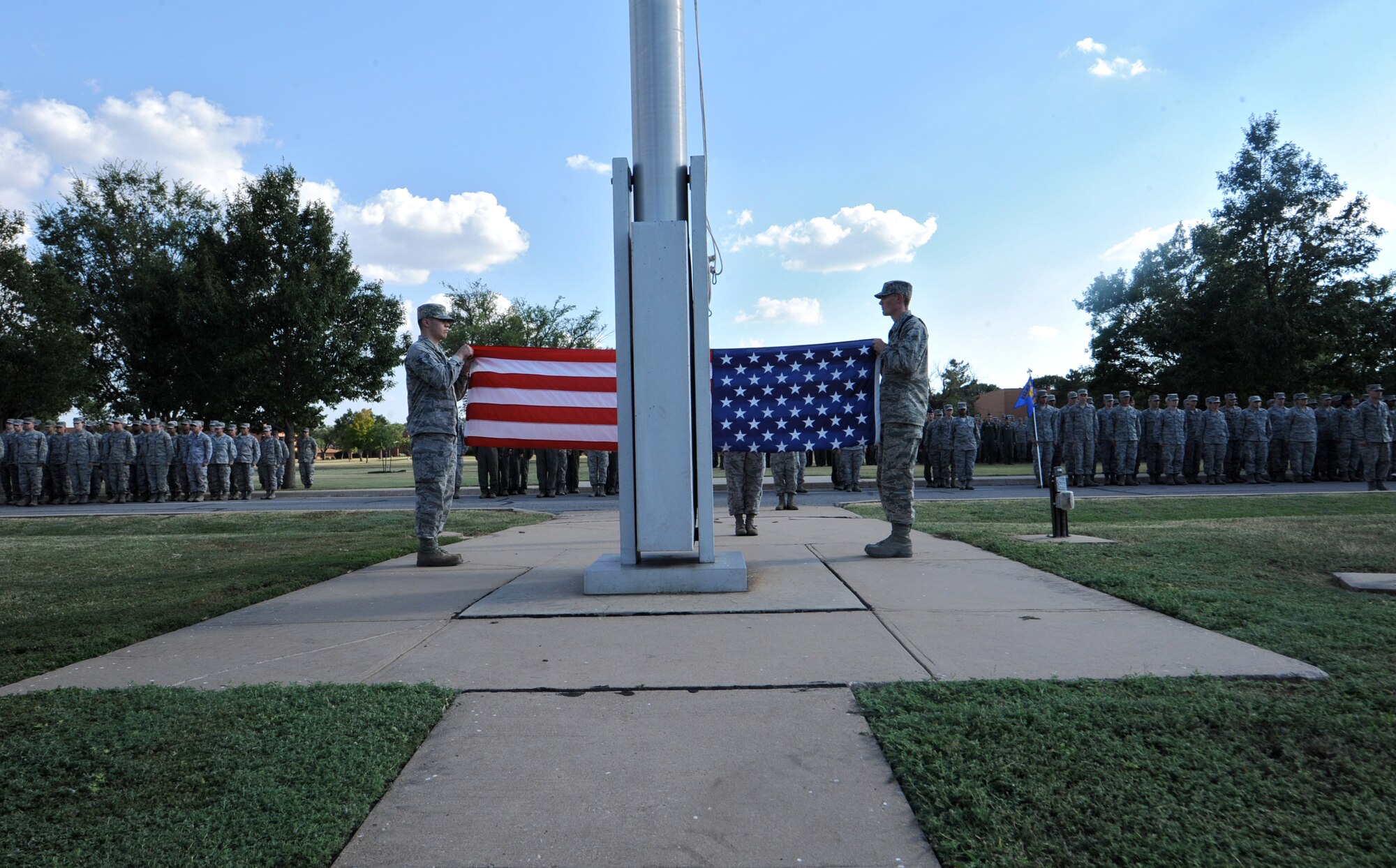 Members of the Silver Talon honor guard fold the flag during a retreat ceremony held Wednesday at Vance Air Force Base, Okla., in memory of the victims of 9/11. (U.S. Air Force photo/ Senior Airman Frank Casciotta)