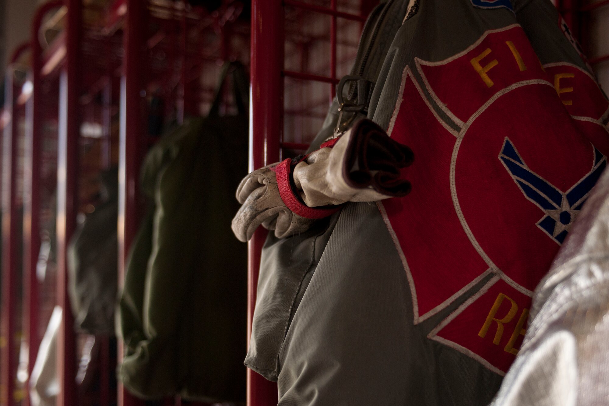 ALTUS AIR FORCE BASE, Okla. -- Members of the 97th Security Forces Squadron and the 97th Civil Engineer Squadron, holds a 9/11 remembrance ceremony Sept. 11 at the base fire department in honor of emergency responders who lost their lives Sept. 11, 2001. The ceremony consisted of the firefighter’s prayer, security forces prayer, a flag folding and the ringing of the final alarm, paying tribute to victims of the tragedy that occurred twelve years ago. (U.S. Air Force Photo by Senior Airman Jesse Lopez / Released)