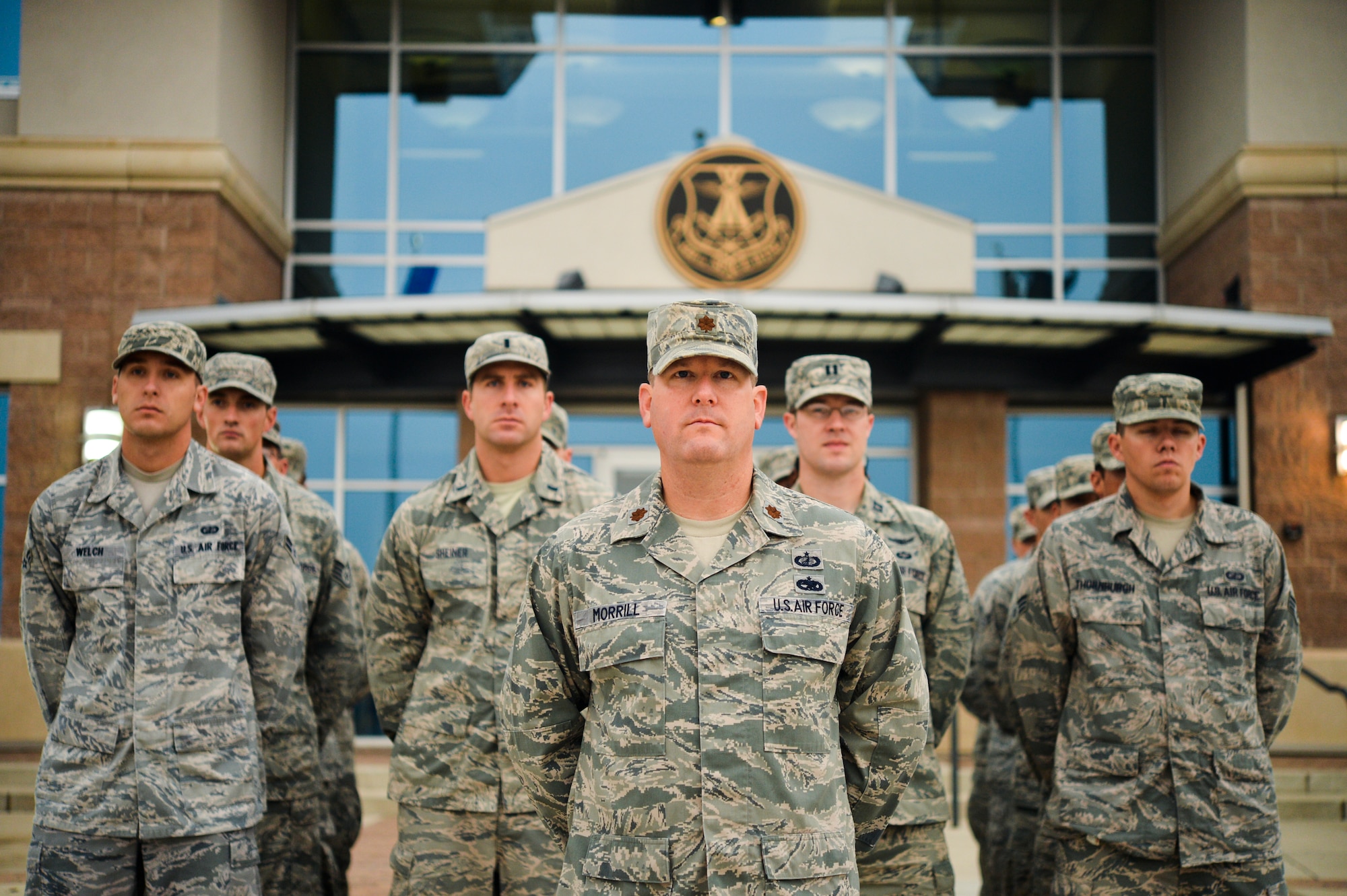 Maj. Jeremy Morrill, 460th Contracting Flight commander, stands at parade rest during the Patriot Day and National Day of Remembrance ceremony Sept. 11, 2013, at the 460th Space Wing headquarters building on Buckley Air Force Base, Colo. The formation was made up of military members from Buckley. (U.S. Air Force photo by Staff Sgt. Paul Labbe/Released)
