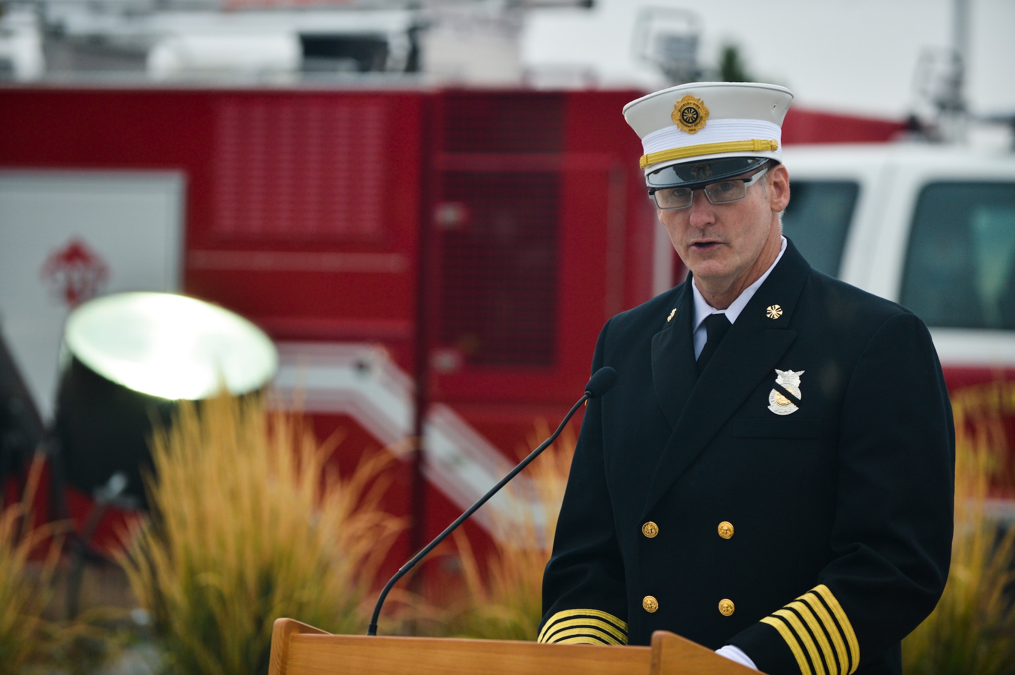 Tim Bosch, 460th Fire and Emergency Services chief, speaks during the Patriot Day and National Day of Remembrance ceremony Sept. 11, 2013 at the 460th Space Wing headquarters building on Buckley Air Force Base, Colo. During the ceremony, Team Buckley remembered those who died during the attacks 9/11 on the World Trade Centers in New York, Pentagon and on United Airlines Flight 93. (U.S. Air Force photo by Staff Sgt. Paul Labbe/Released)