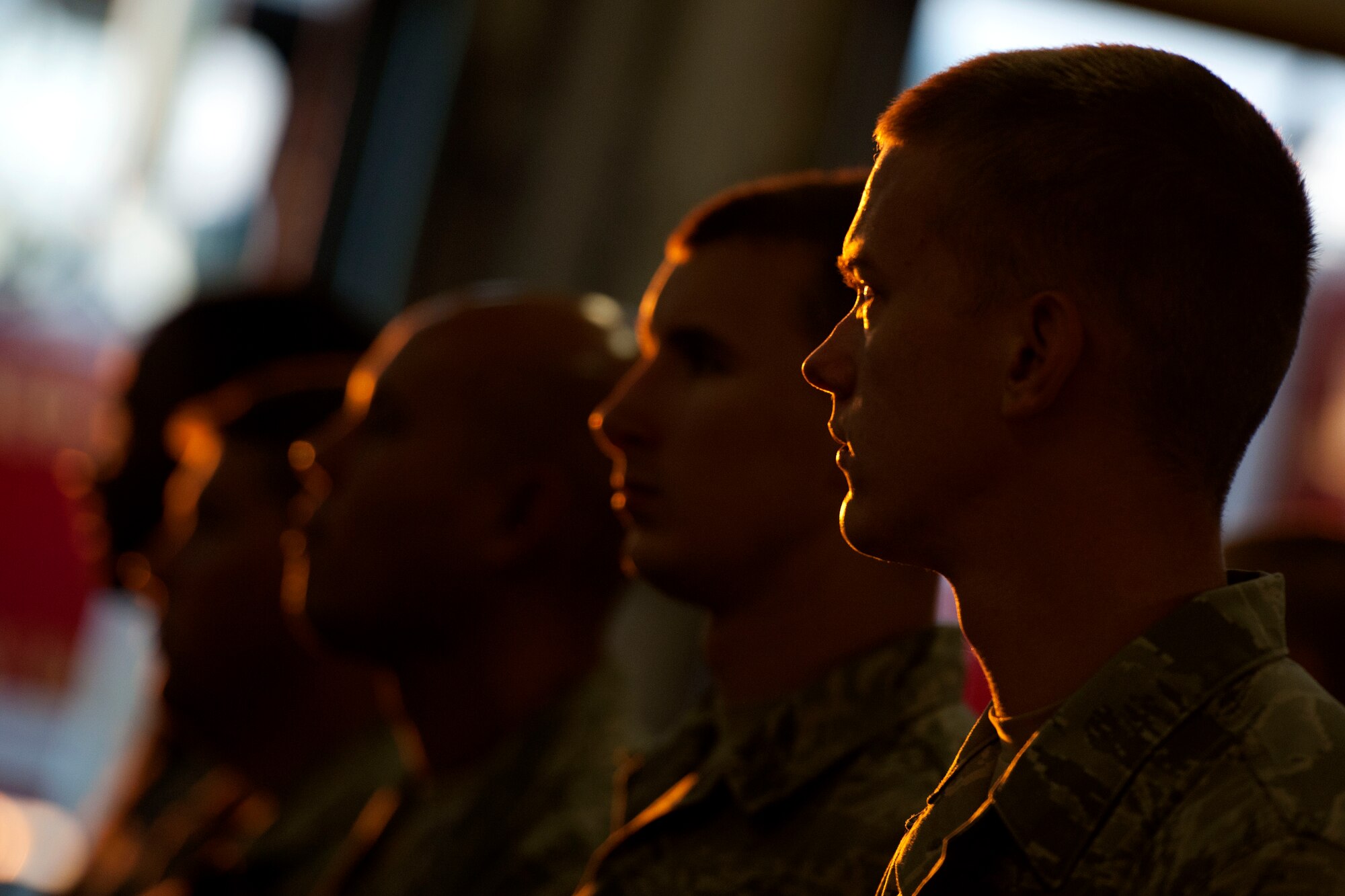 ALTUS AIR FORCE BASE, Okla. -- Members of the 97th Security Forces Squadron and the 97th Civil Engineer Squadron take part in a 9/11 remembrance ceremony Sept. 11 at the base fire department in honor of those who lost their lives Sept. 11, 2001. The ceremony consisted of the firefighter’s prayer, security forces prayer, a flag folding and the ringing of the final alarm, paying tribute to victims of the tragedy that occurred twelve years ago. (U.S. Air Force Photo by Senior Airman Jesse Lopez / Released)