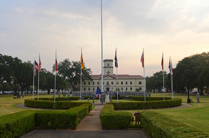 Airmen from Airman Leadership School prepare to raise the flag during the 9/11 Remembrance Ceremony on Barksdale Air Force Base, La., Sept. 11, 2013. The flag was raised during the 'National Anthem' and left at half-staff to honor those who lost their lives Sept. 11, 2001. (U.S. Air Force photo/Senior Airman Micaiah Anthony)