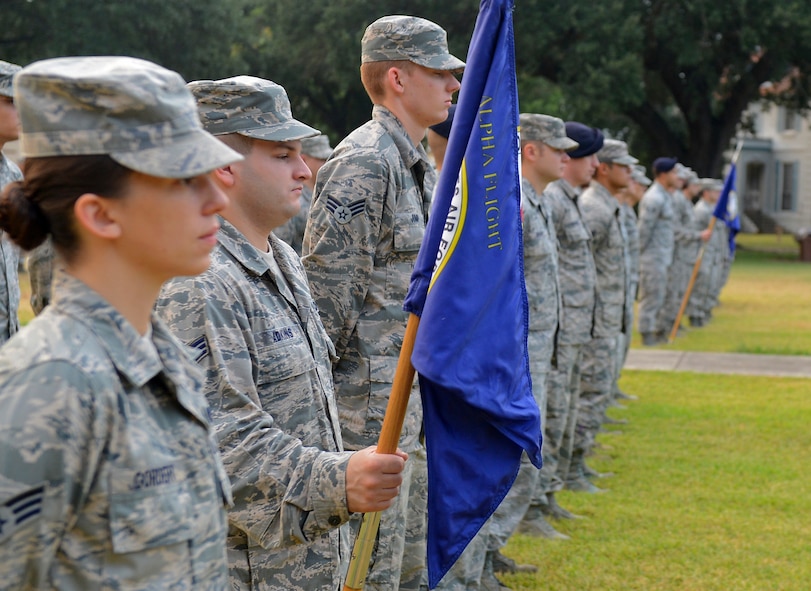 Airmen from Airman Leadership School stand at parade rest before reveille on Barksdale Air Force Base, La., Sept. 11, 2013. Members of Team Barksdale gathered to honor the fallen of Sept. 11, 2001 and those who lost their lives defending the Nation. (U.S. Air Force photo/Senior Airman Micaiah Anthony)