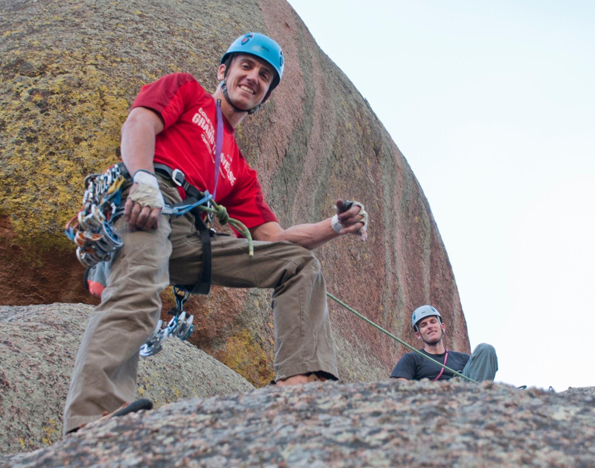 Capt. Austin Winner, 90th Operations Group evaluator, and Capt. Jeff Rees, 321st Missile Squadron flight commander, pose atop a rock ledge at Vedauwoo, Wyo., Aug. 28, 2013. (U.S. Air Force photo by Airman 1st Class Jason Wiese)