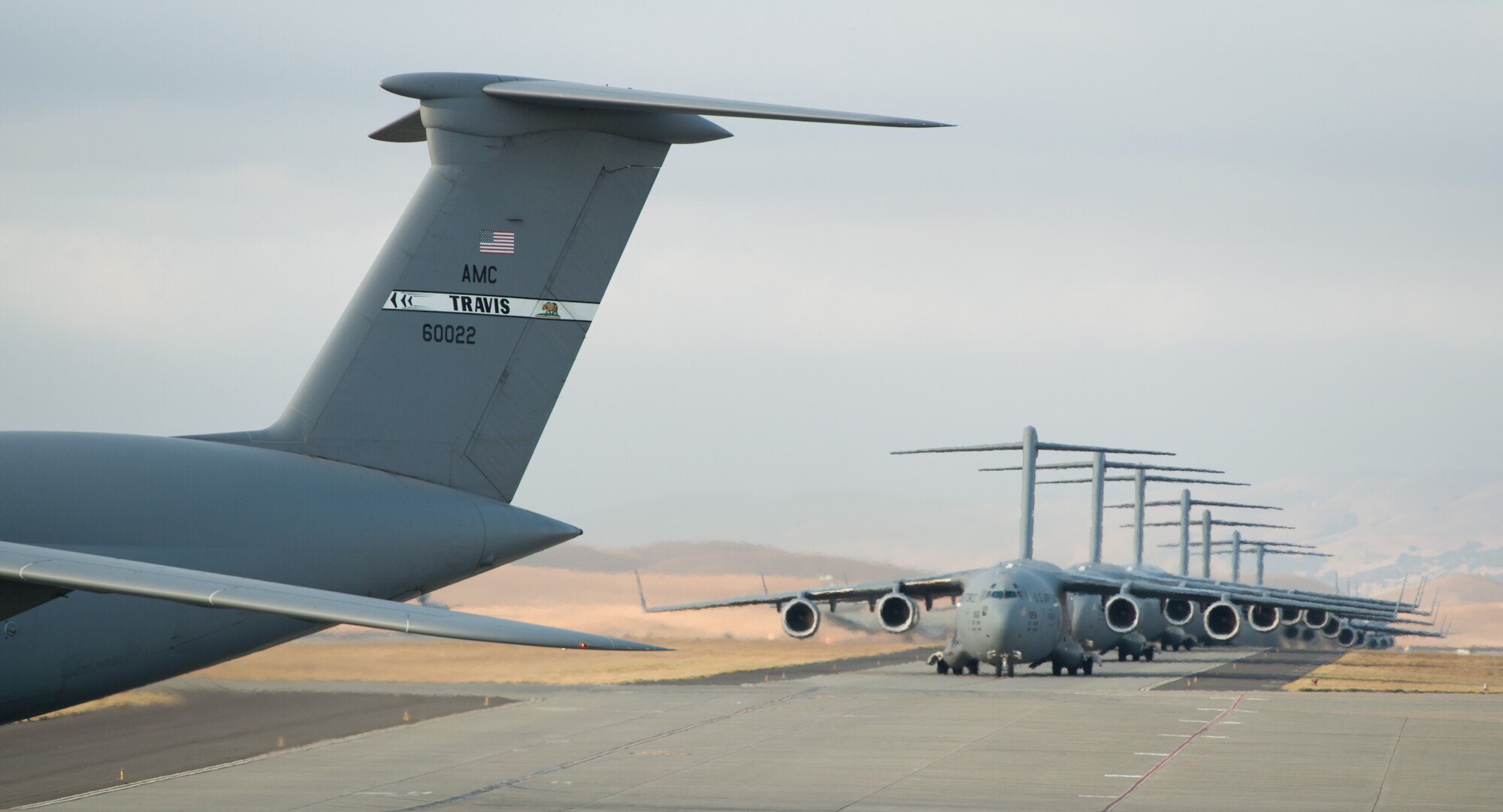 A 22-aircraft "freedom launch" took place at Travis AFB, Calif., Sept. 11, 2013. Seven C-17 Globemaster IIIs, 11 KC-10 Extenders and four C-5B Galaxies from the 60th Air Mobility Wing lined up in what is historically referred to as an "elephant walk," then launched consecutively over 36 minutes to take part in Air Mobility Command missions. The first plane in the lineup, a C-17, launched at 8:46 a.m., the same time terrorists crashed American Airlines Flight 11 into the North Tower of the World Trade Center in New York City 12 years earlier. (U.S. Air Force photo/Ken Wright)