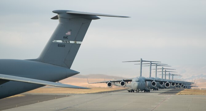 A 22-aircraft "freedom launch" took place at Travis AFB, Calif., Sept. 11, 2013. Seven C-17 Globemaster IIIs, 11 KC-10 Extenders and four C-5B Galaxies from the 60th Air Mobility Wing launched consecutively over 36 minutes to take part in Air Mobility Command missions. The first plane in the lineup, a C-17, launched at 8:46 a.m., the same time terrorists crashed American Airlines Flight 11 into the North Tower of the World Trade Center in New York City 12 years earlier. (U.S. Air Force photo/Ken Wright) 

